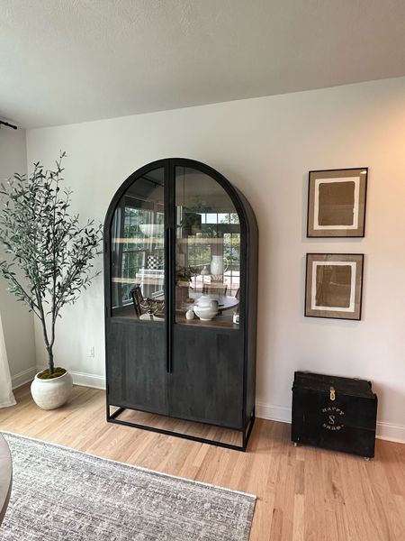 Loving this arch cabinet wall, art decor in our dining nook. The natural Jude artwork compliments, perfect with the black and Wood toned arch cabinet.

#LTKHome #LTKSaleAlert #LTKFamily