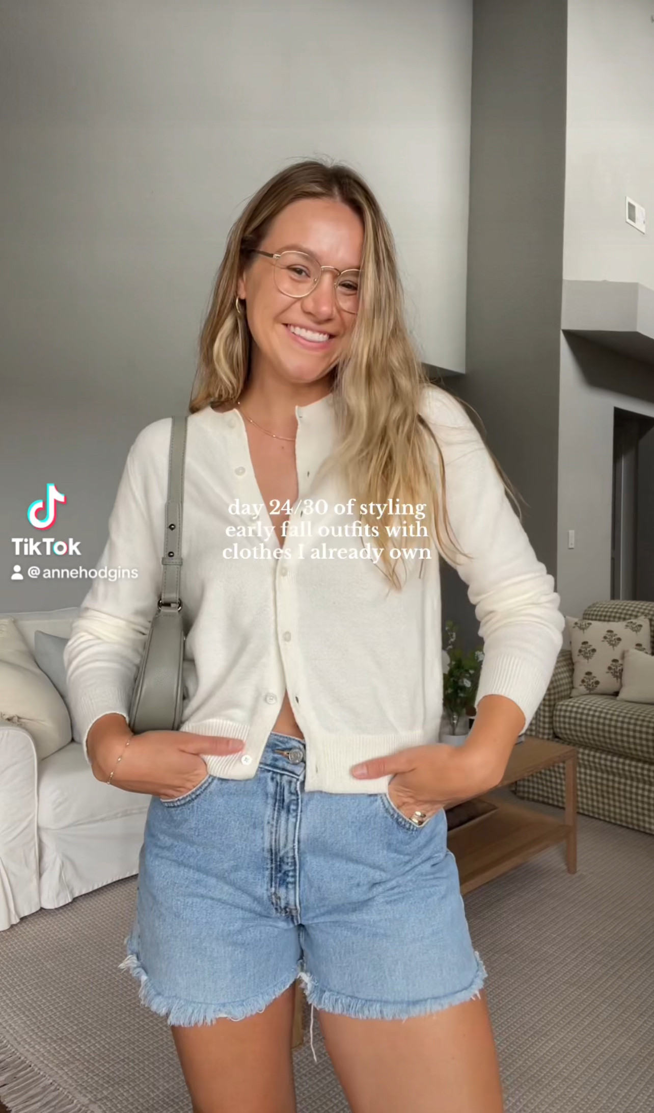 Cardigan is old navy last year, wearing medium. Shorts are vintage Levi’s. Bag is Ela handbags. Glasses are Eyebuydirect. Cowboy boots are Ariat 🫶🏼