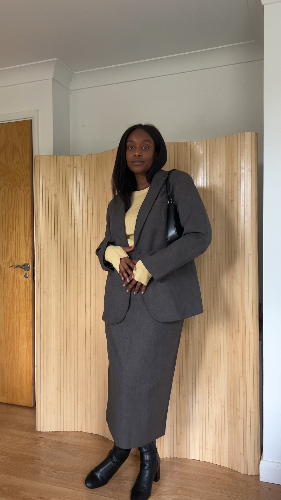 So here for the skirt suiting trend coming back a autumn capsule wardrobe Essential for me! Styling this Yellow long sleeve top and midi skirt in textured grey are the perfect combo! styling them with knee high boots and a black
leather shoulder bag gives the 90s minimal autumn chic vibes  look I just love! 

#LTKSeasonal #LTKstyletip #LTKmidsize