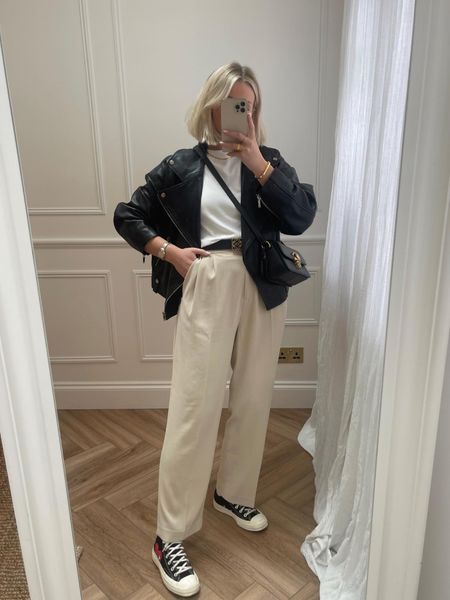 Smart casual look for spring - comme les garçons converse trainers, h&m beige wide leg tailored trousers, Loewe anagram belt (great dupe linked!), cos white t-shirt, leather jacket, gold snake chain necklace & coach studio crossbody bay  

#LTKstyletip #LTKeurope #LTKSeasonal