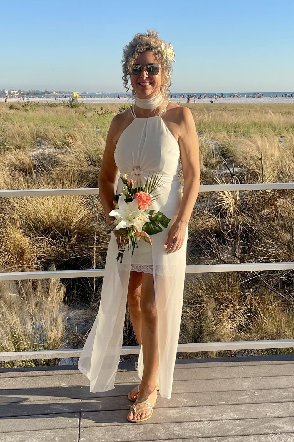 Dreaming of a beach wedding that feels effortless, elegant, and age-confident? As someone who got married a year and a half ago, I chose a short ivory dress with flowing chiffon panels—and it was perfect. The lightweight fabric kept me cool, and the chiffon panels caught the ocean breeze beautifully for those unforgettable photos. If you're searching for wedding dresses for older brides, learn more about what to look for in wedding dresses for over 50 older bride styles, check out my blog DressingArtist.com #beachweddingdresses #weddingdressesolderbride #weddingdresseswomenover50 

 #LTKOver40 #LTKWedding