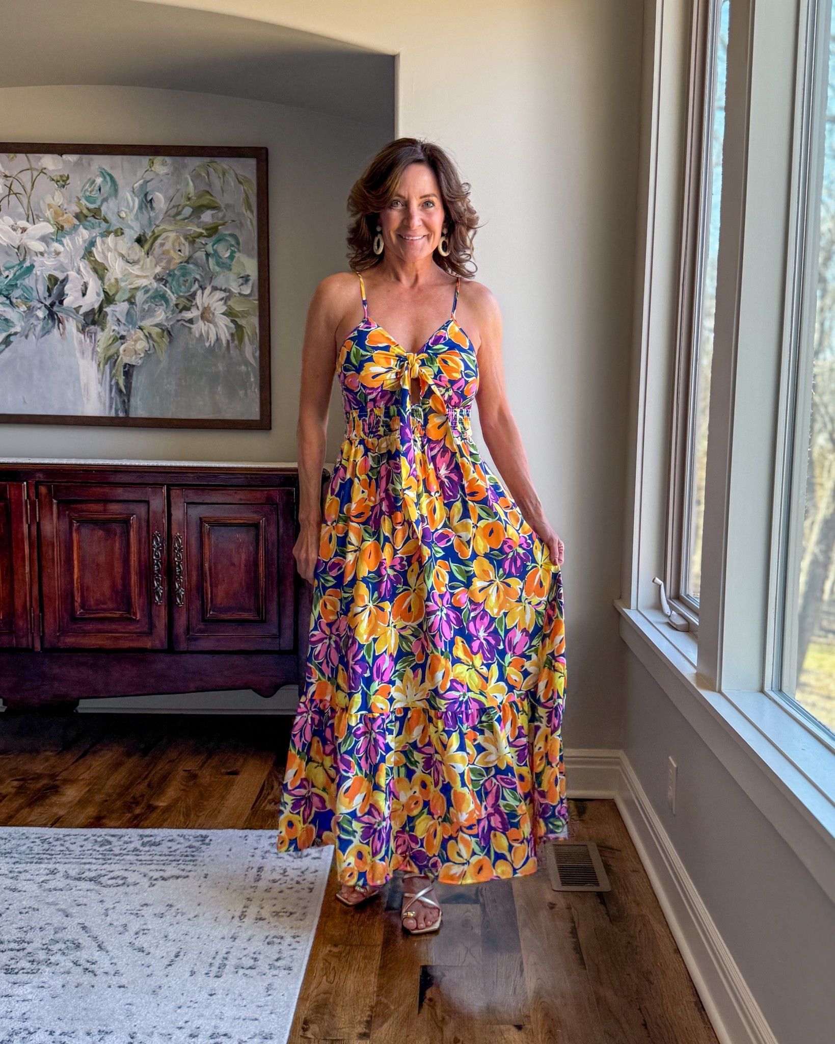 Vibrant Floral Maxi Dress That Flatters and Moves

This is the kind of dress that instantly lifts your mood. The tie-front detail defines the waist, the flowy skirt gives movement, and the saturated floral print feels confident and feminine. Perfect for dinner on vacation, summer weddings, or anytime you want to feel put-together without trying too hard.

#SummerStyle #AmazonFashion #MidlifeStyle #BoldFashion #VacationOutfits