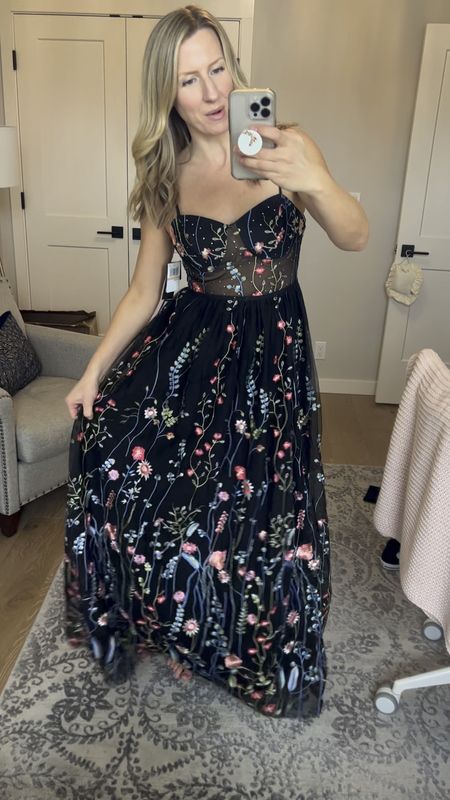 This formal gown is black with colorful embroidered flowers! It is a stunning formal dress for any formal event! #formal #formalevent

#LTKparties #LTKwedding #LTKstyletip