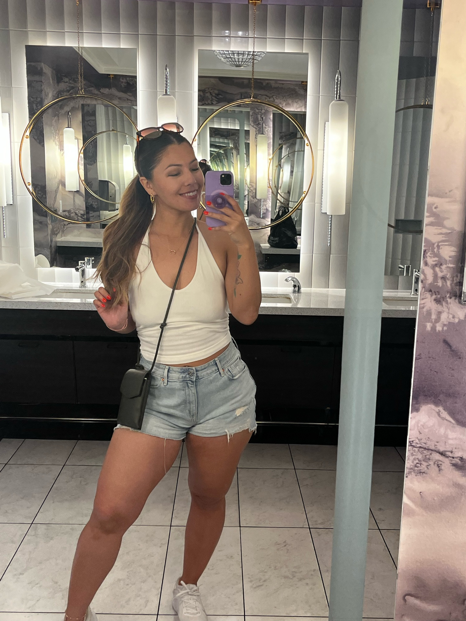 Casual Vegas outfit 
Halter top, white halter, jean shorts, wallet bag, travel outfits, phone crossbody bag, white tennis shoes, white nikes

#LTKstyletip #LTKfindsunder50 #LTKfindsunder100