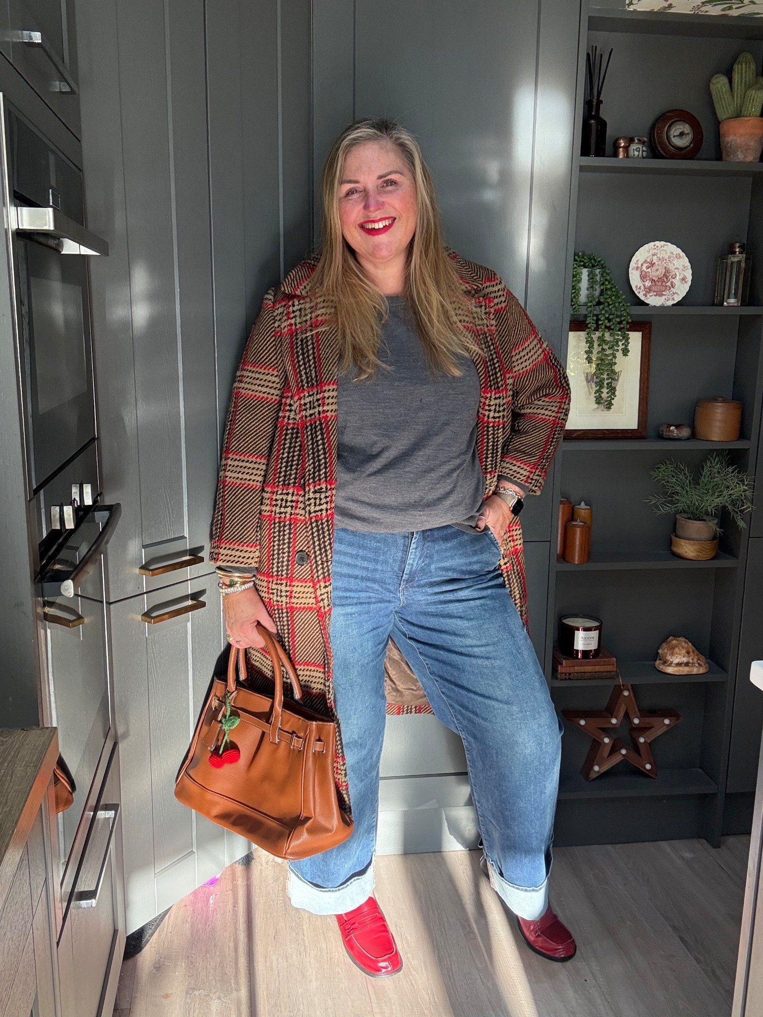 Red loafers, tan bag, tan checked coat, grey jumper, turn up wide leg jeans 

#LTKjeans #LTKwinter #LTKplussize