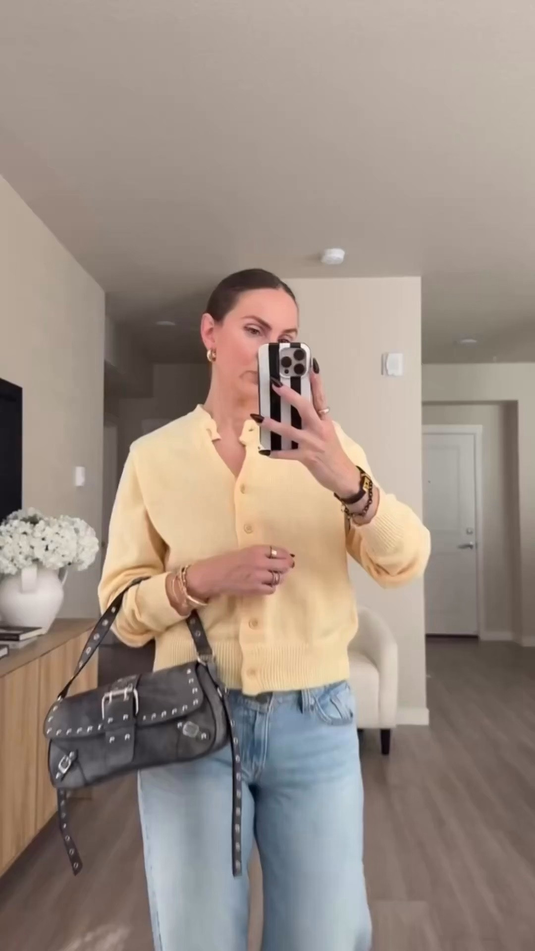 this cardigan is beautiful.  amazing quality!!! love this butter yellow shade for fall.  wearing small ( i am 5'7 ) returned to size up to a medium for a loser fit.