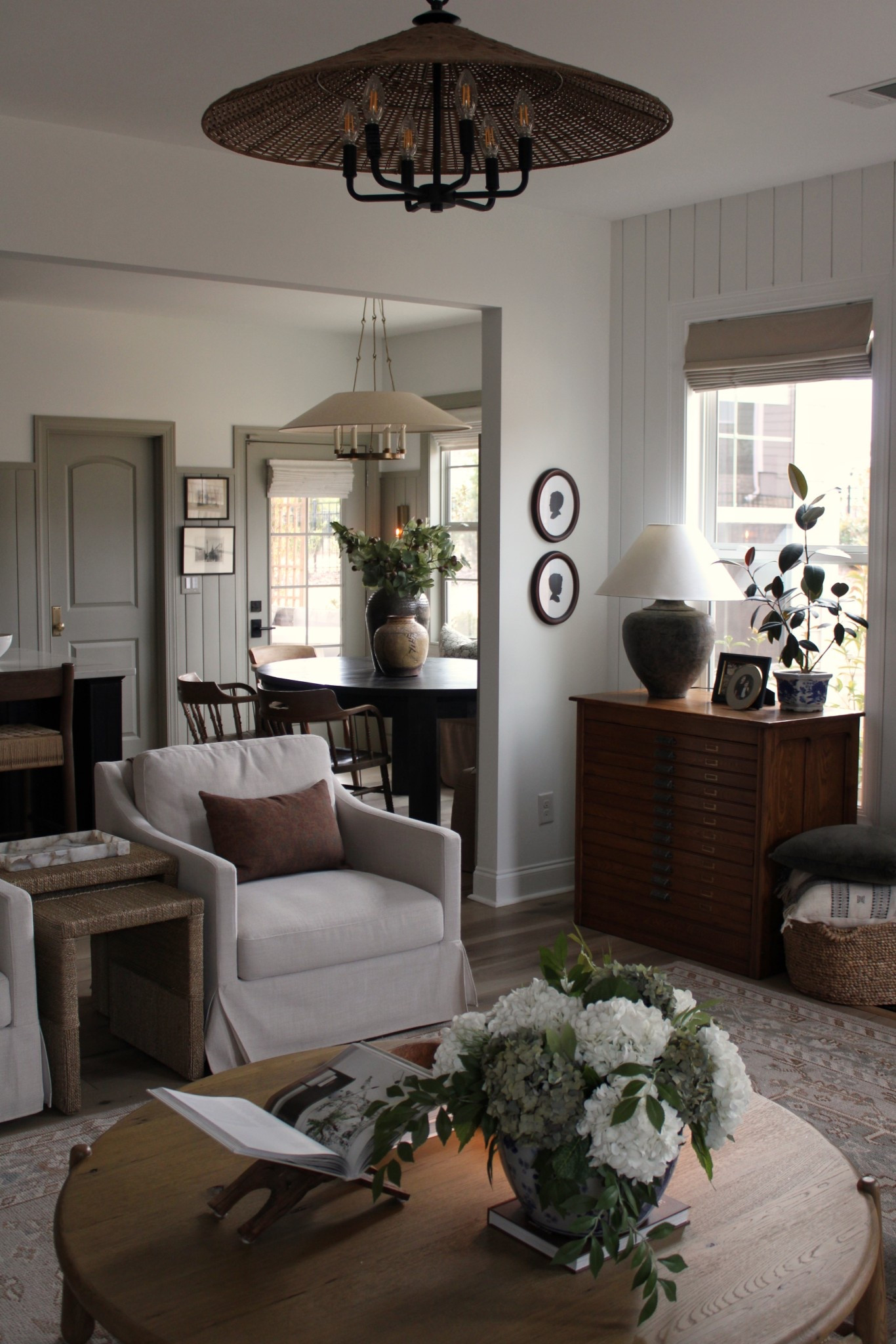 Living room and kitchen nook views, silhouettes, slipcovered swivel
Chairs, kitchen pendant, modern chandelier 

#LTKHome