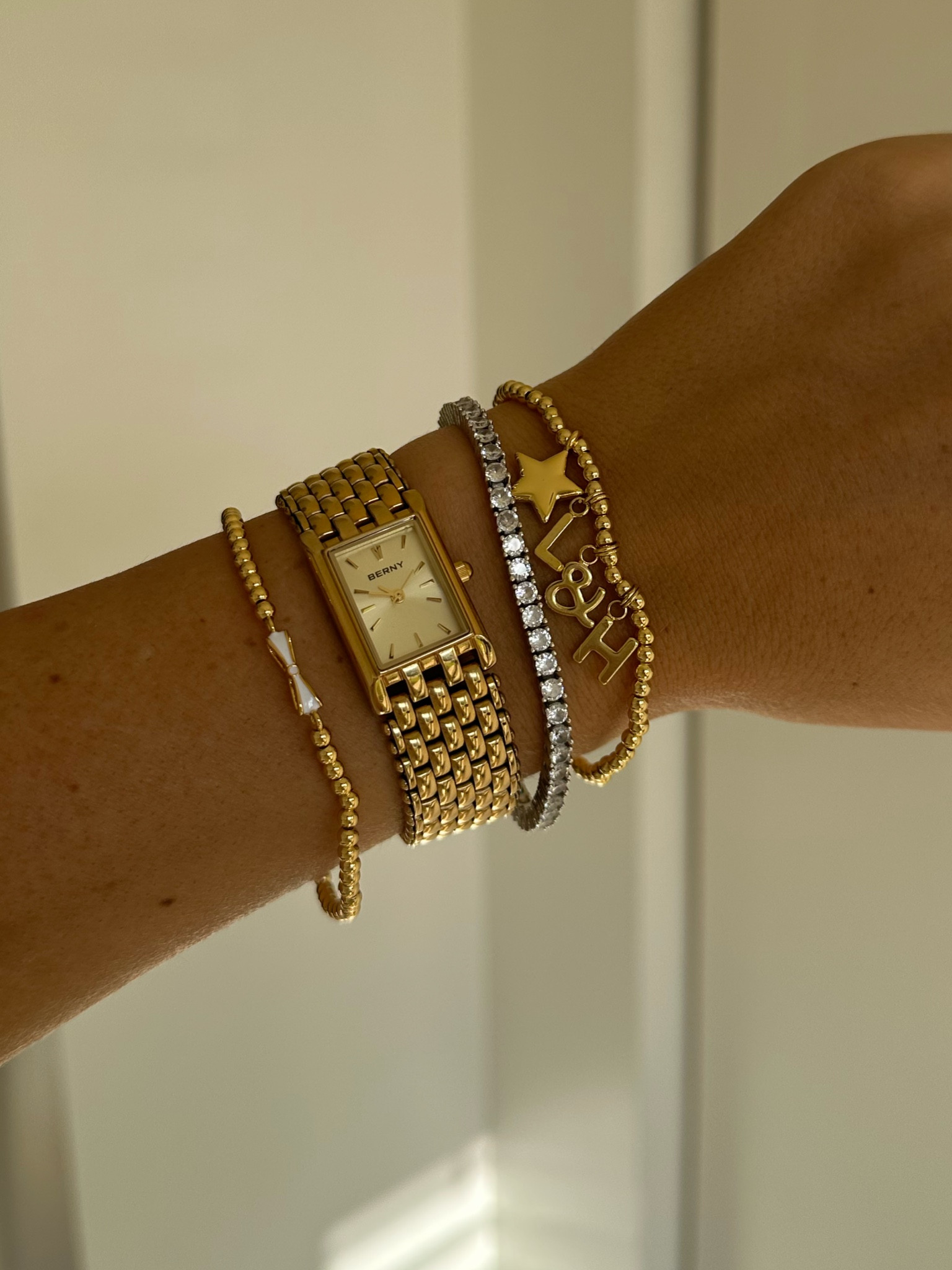 Bracelet stack with customizable gold charm bracelet from a littles and co! Such a cute gift for a bride to be! This watch is also $50 on amazon! On sale now 🤍✨

#LTKstyletip #LTKfindsunder50 #LTKwedding