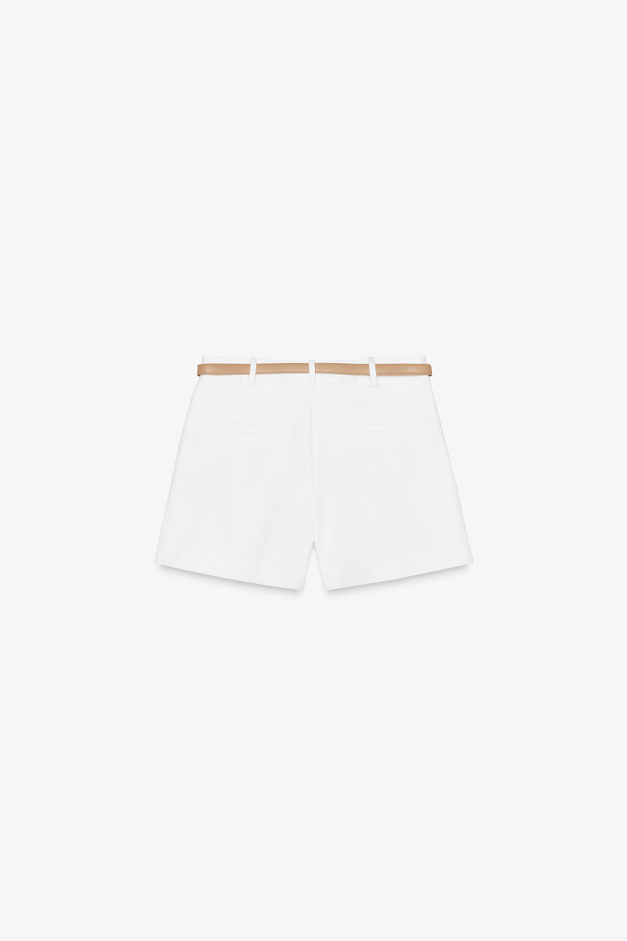 Mid-waist Bermuda shorts with front darts and a belt. Featuring front pockets and false welt pock... | Zara UK