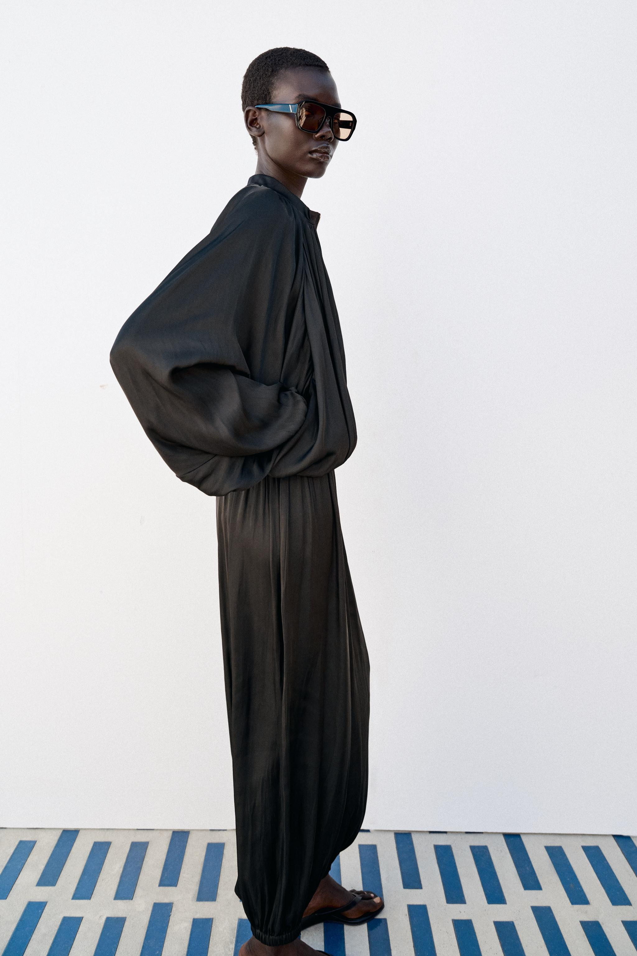 Flowy jacket with a round neck and long sleeves with elastic cuffs and dropped shoulders. Front p... | Zara US