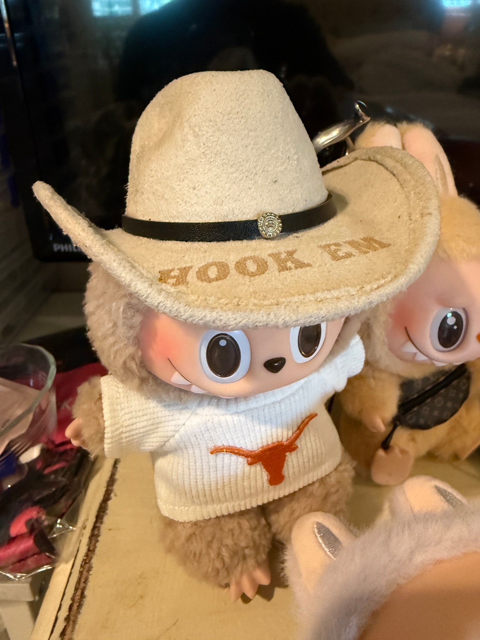 My Labubu loves his new custom Hook Em gameday hat from Freebird Revolution on @Etsy !! I chose white for the hat color it’s actually an oatmeal color and feels like a soft suede….high quality!! The font I chose was option 1….turned out perfect!! We are ready for kickoff now!! 🤘🤘🤘🤘🤘