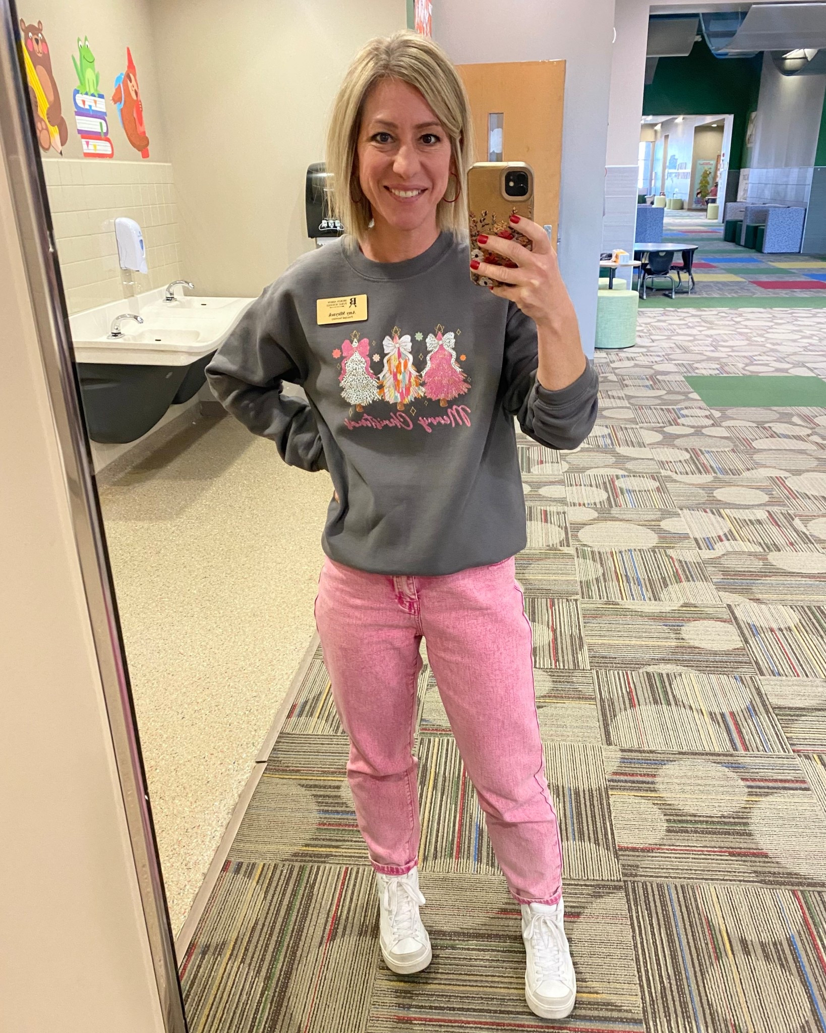 Christmas, but make it pink! I’ve had my jeans for over a year, but linked similar. My friend heat pressed this iron on decal on my sweatshirt for me and it turned out so cute! 💗🎄🩷