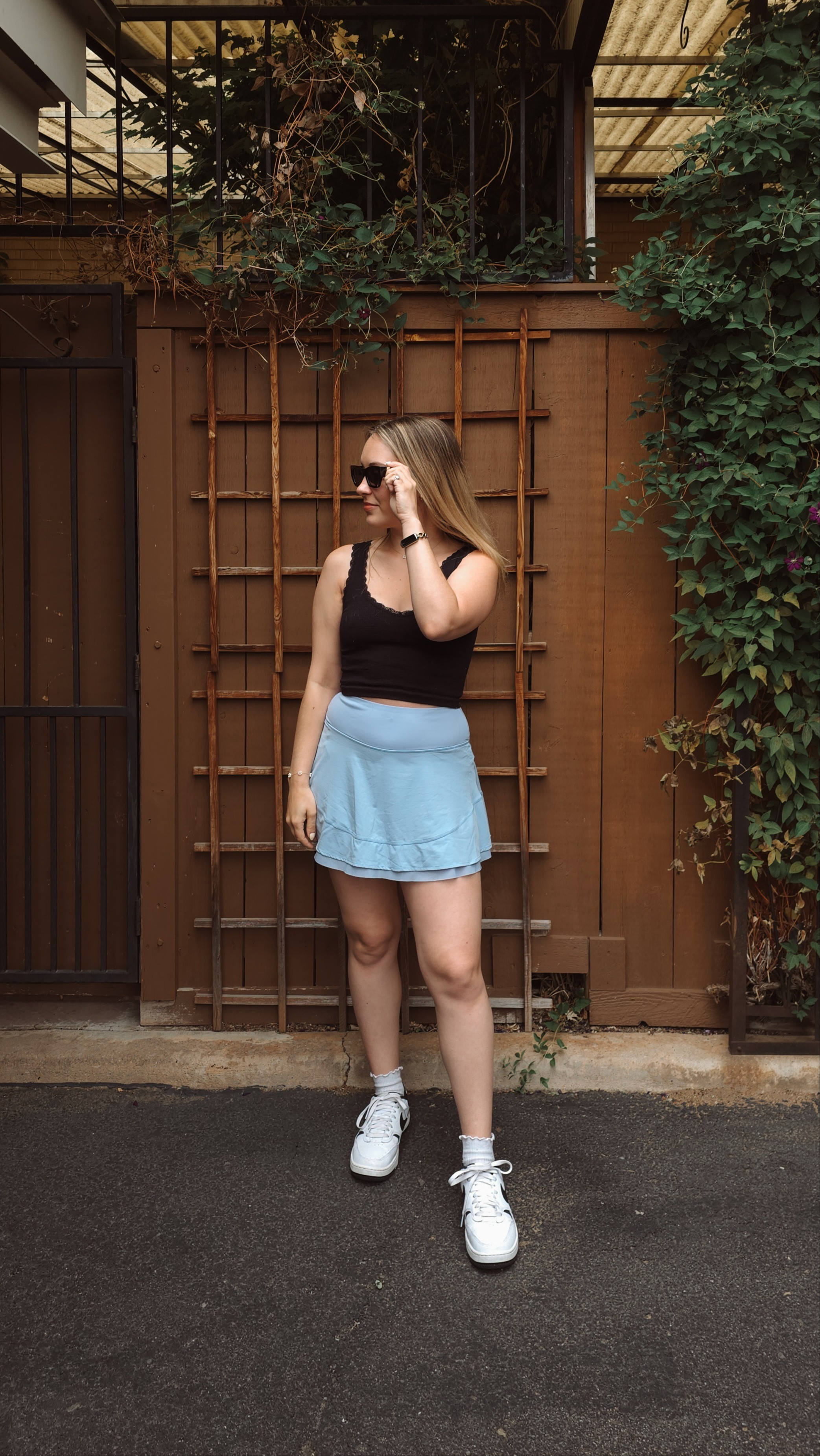 casual outfit in one of my latest halara skorts 🫶🏻 wearing a size small. also wearing my amazon sunglasses & the cutest lettuce hem socks! 

#LTKShoeCrush #LTKActive #LTKFindsUnder50