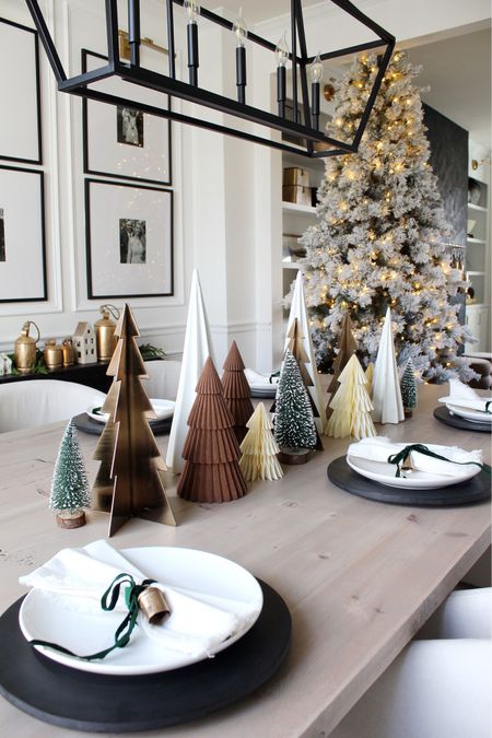 Dining table, Christmas trees, plate chargers, bells 

#LTKhome #LTKSeasonal #LTKHoliday