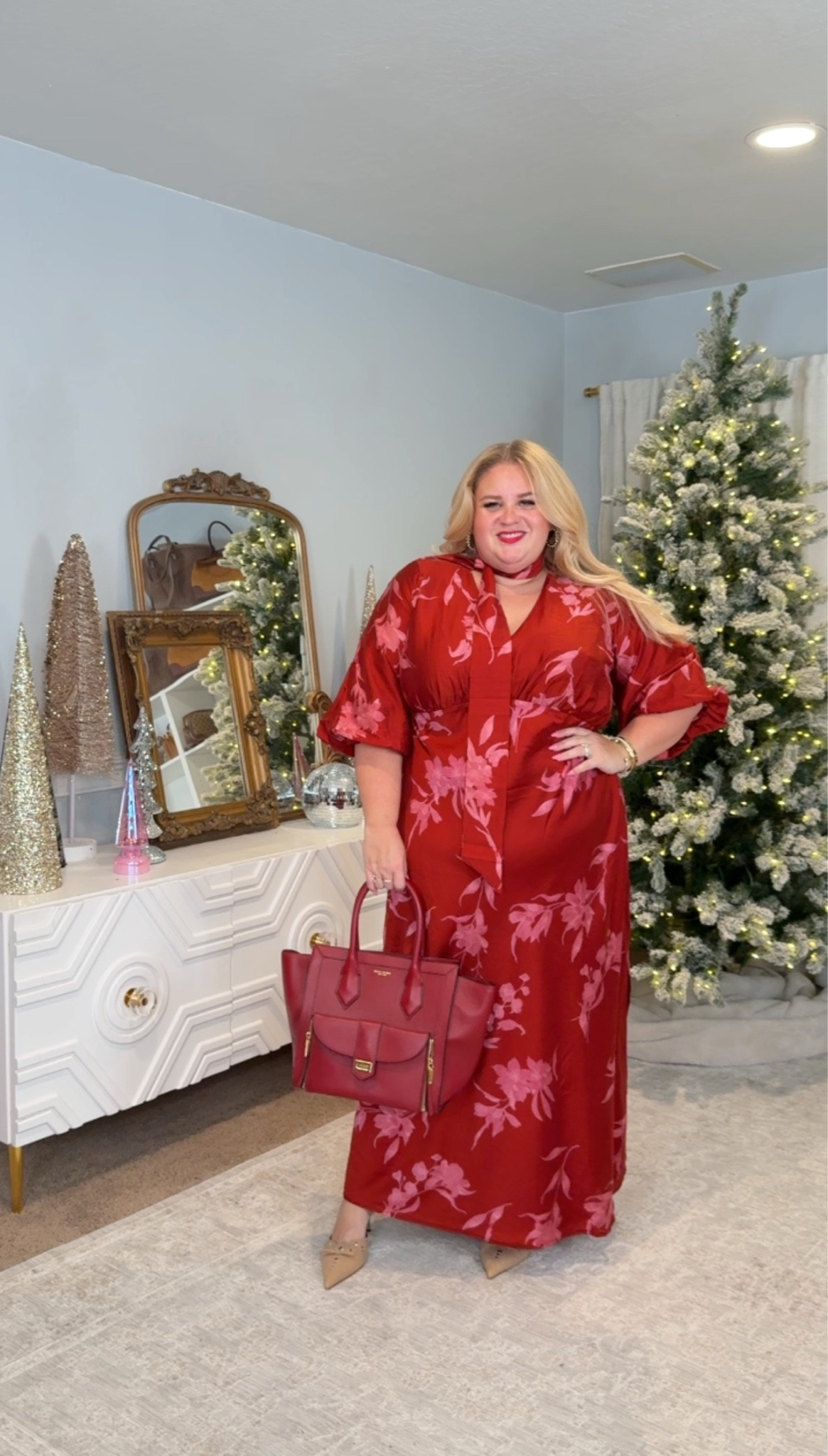 Holiday-ready in the easiest way possible.

This satin floral dress gives you shape without clinging, the sleeves are comfortable, and the color is rich enough to look expensive. I styled it with pointed nude heels to elongate the leg and a structured red bag to keep everything polished.

Dress size 1X
Heels size 9.5

Perfect for holiday parties, Christmas events, or anything where you want to look put together without trying too hard.

#LTKFindsUnder50 #LTKPlusSize #LTKHoliday