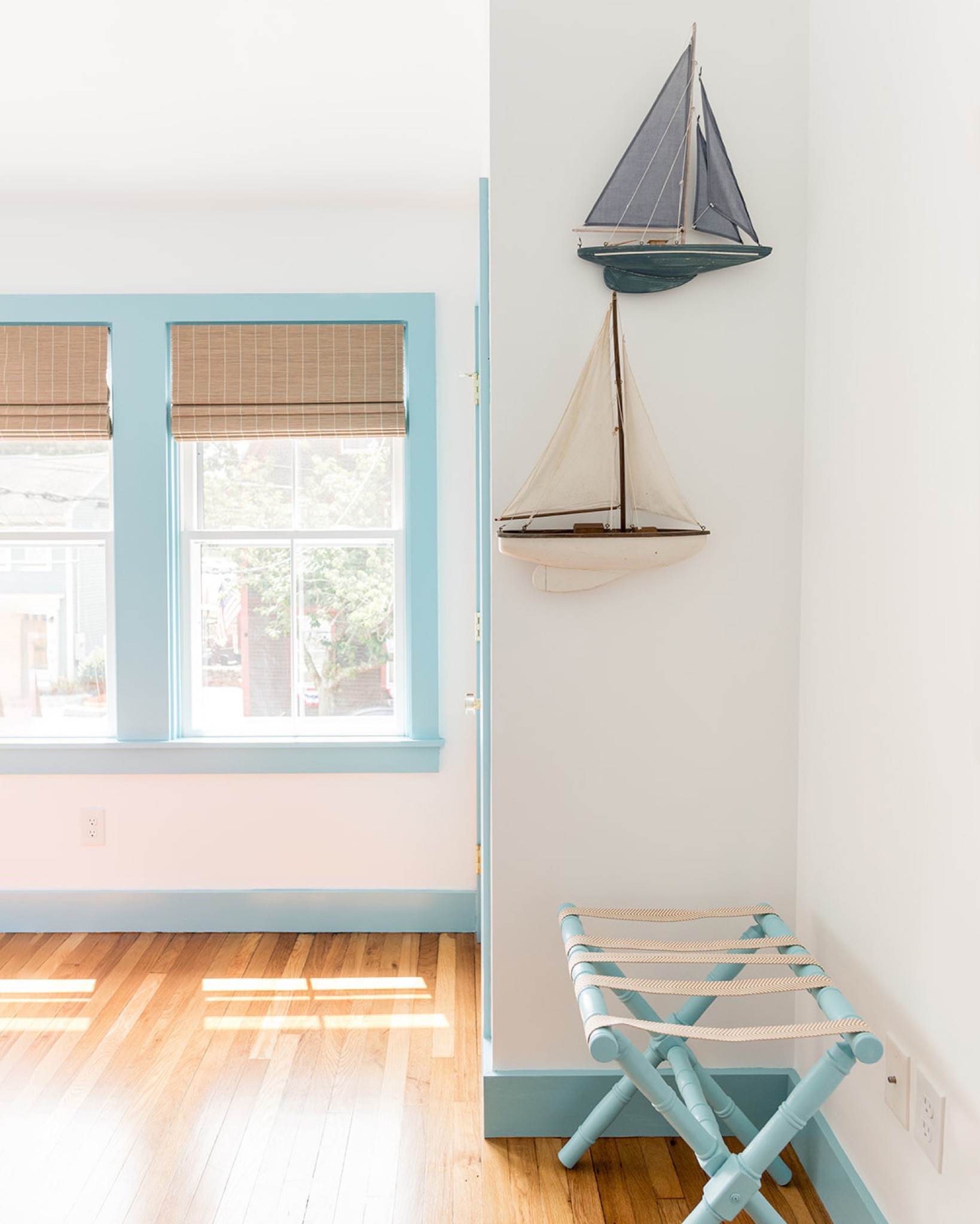 prior to the renovation, the residential unit of the #mixedusemini had a quirky floor plan where you had to walk through one bedroom to get to the other. in an effort to make the space more guest-friendly, we made a few small changes to the layout in order to create two bedrooms with separate entrances. this pretty vignette featuring model sailboats and a vintage luggage rack greets guests when they walk through the door to one of the bedrooms. #dwelloctoberstay #dwelloctober

#LTKHome