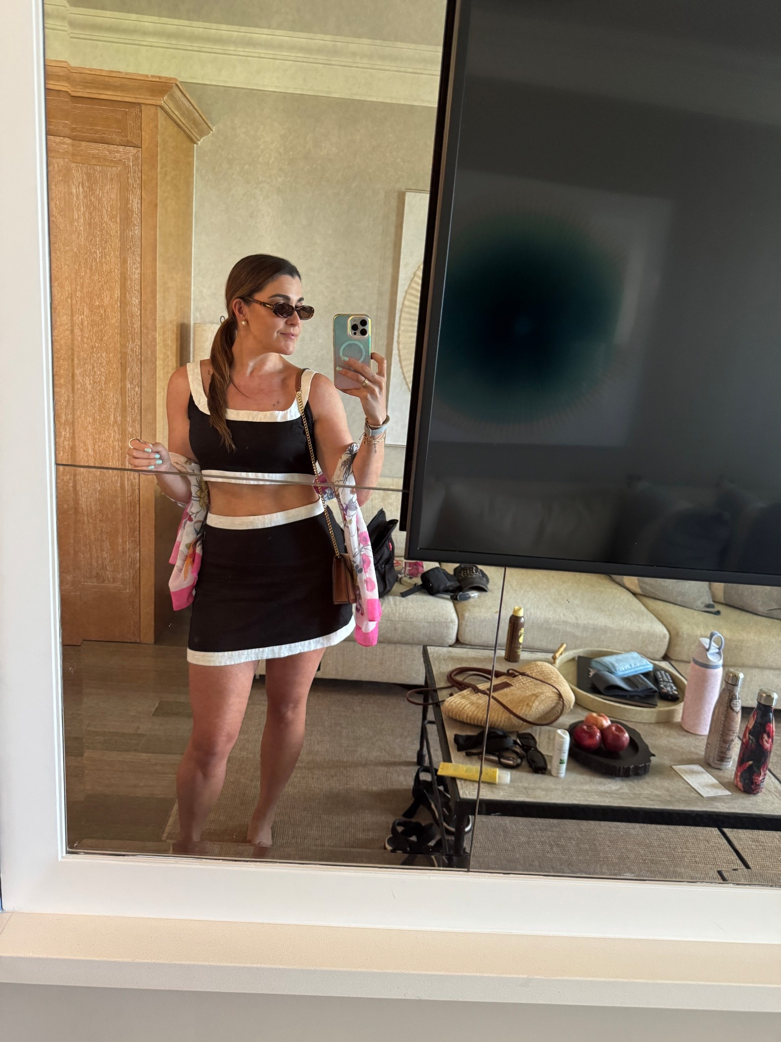 2nd season for this chic mod reformation moment 💅 

black white resortwear two piece, retro oval sunglasses, floral shawl, chanel gladiators, sezane raffia bag, celine teen triomphe 

#LTKSummerEdit #LTKTravel #LTKSeasonal