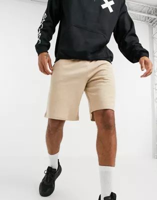 ASOS DESIGN oversized jersey shorts in beige | ASOS (Global)