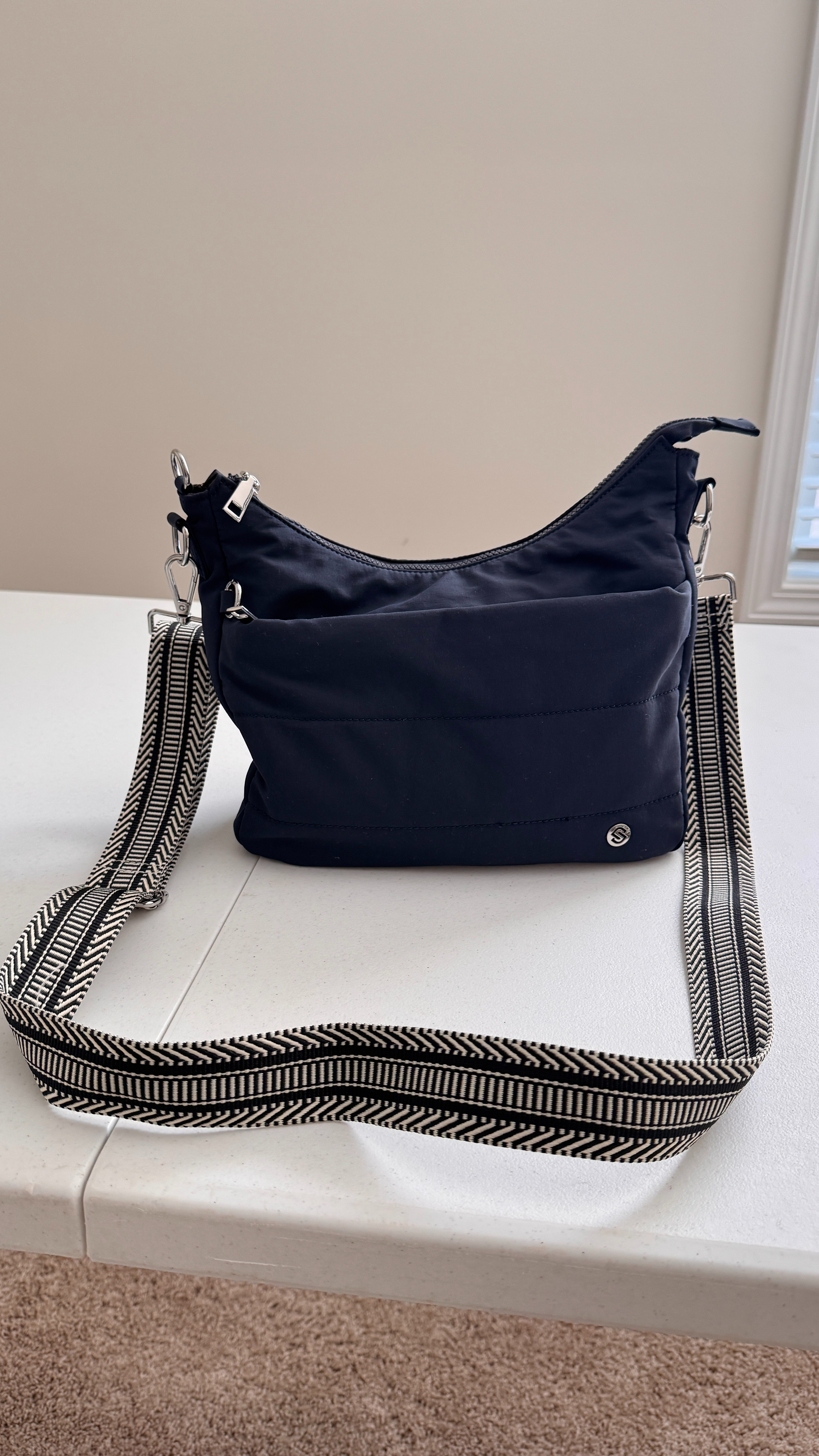 When I vacation, I want a purse that will carry what I need but isn't too big. It is packable and also anti-theft. This one fits the bill. 
#travelfind 

 #LTKOver40 #LTKTravel