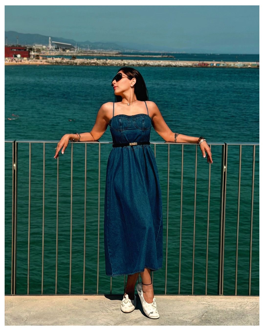 Seaside blues in the perfect denim midi. 🌊
💙 Denim is having such a major moment, and this Commense dress absolutely nails the trend while keeping that effortless, elevated vacation vibe. The corset-style bodice detailing is incredibly flattering, and the length is just right! Paired it with a classic black belt and comfortable sneakers for a day of exploring by the water. 

 #LTKvlog #LTKSeasonal #LTKTravel