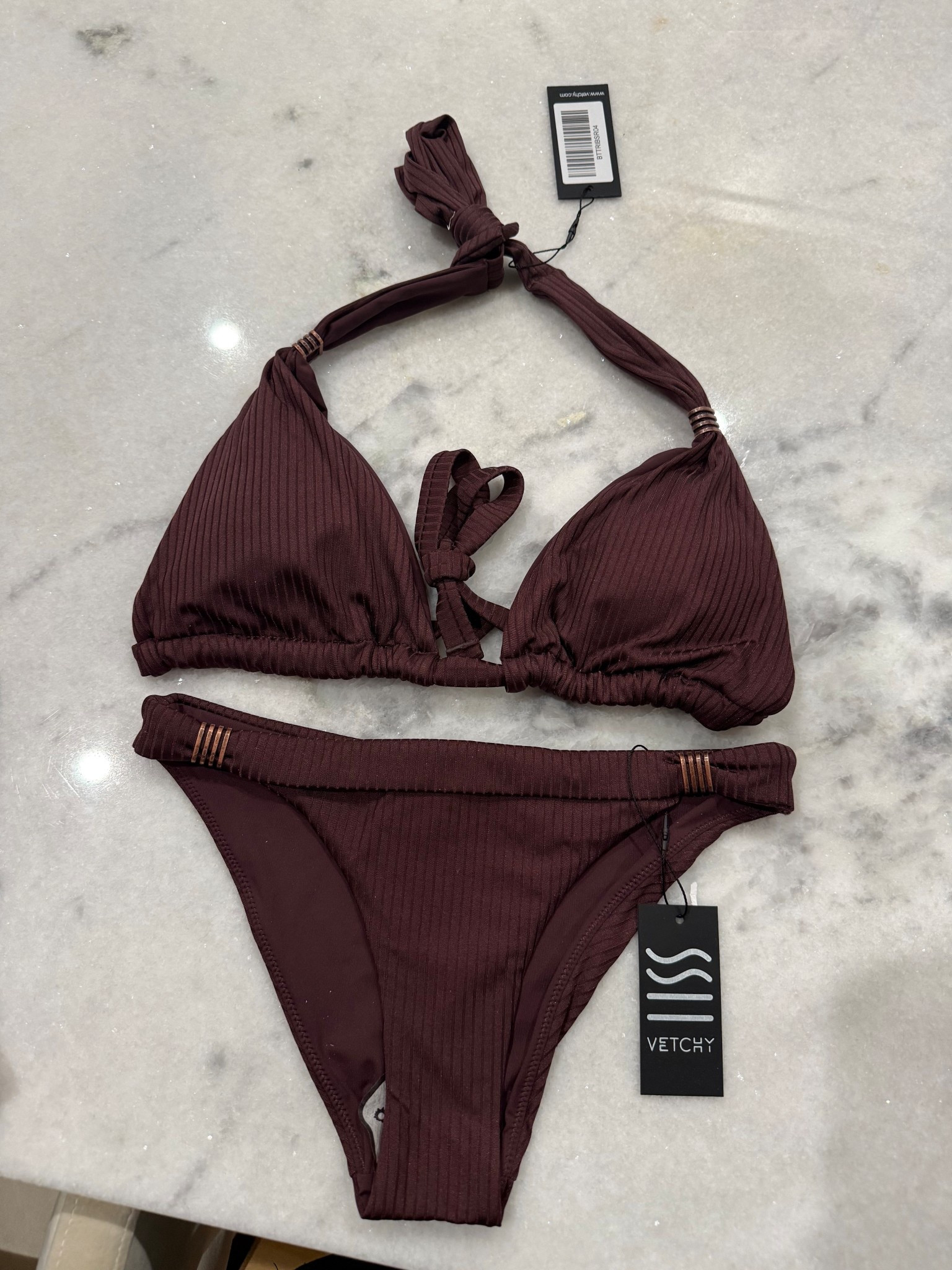Chocolate brown triangle bikini with pretty detailing size m top xs bottoms 

#LTKSwim #LTKTravel