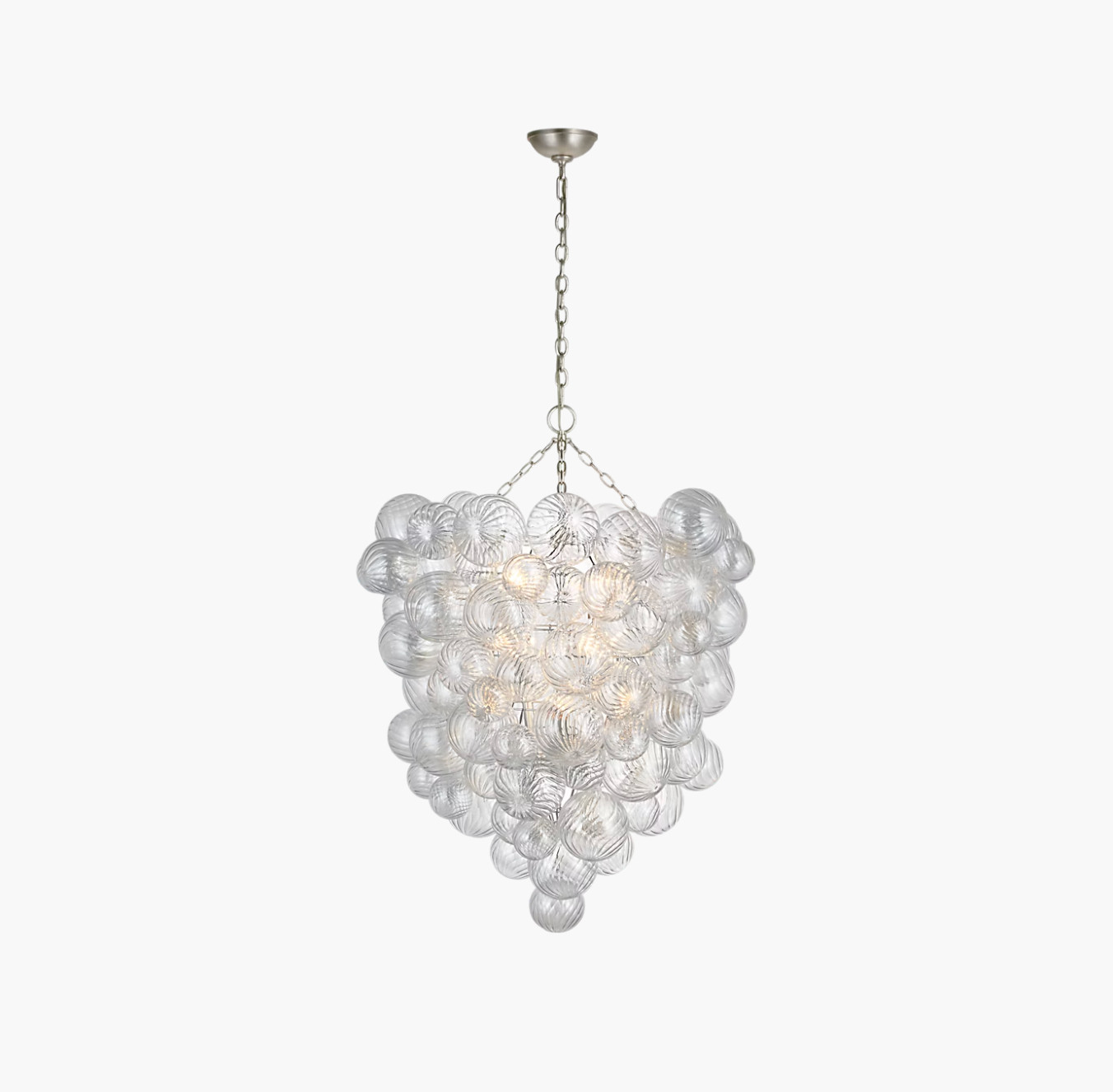 Julie Neill swirled glass orbs into metal baskets and made a chandelier that catches light like jewelry. Multiple globes, hand worked, no two exactly alike. Hang it in an entry and the room announces itself before anyone says hello.
Glam, suspended.
#TaliaChandelier #JulieNeill #ArtisanalLighting #StatementChandelier #EntryDesign #LightingDesign #InteriorDesign #ModernGlam #DesignerLighting #HomeDecor 

 #LTKHome