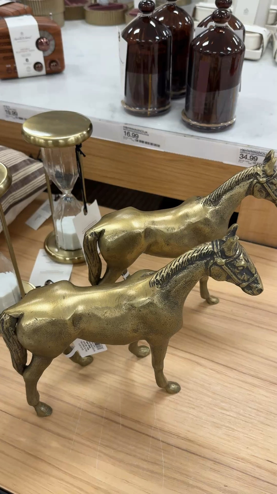 New Hearth and Hand at Target. You can’t go wrong with a pretty match cloche. It’s pretty to set on a coffee table and is functional as well. Brass horse figurine, gold hourglass object

#LTKSeasonal #LTKHome