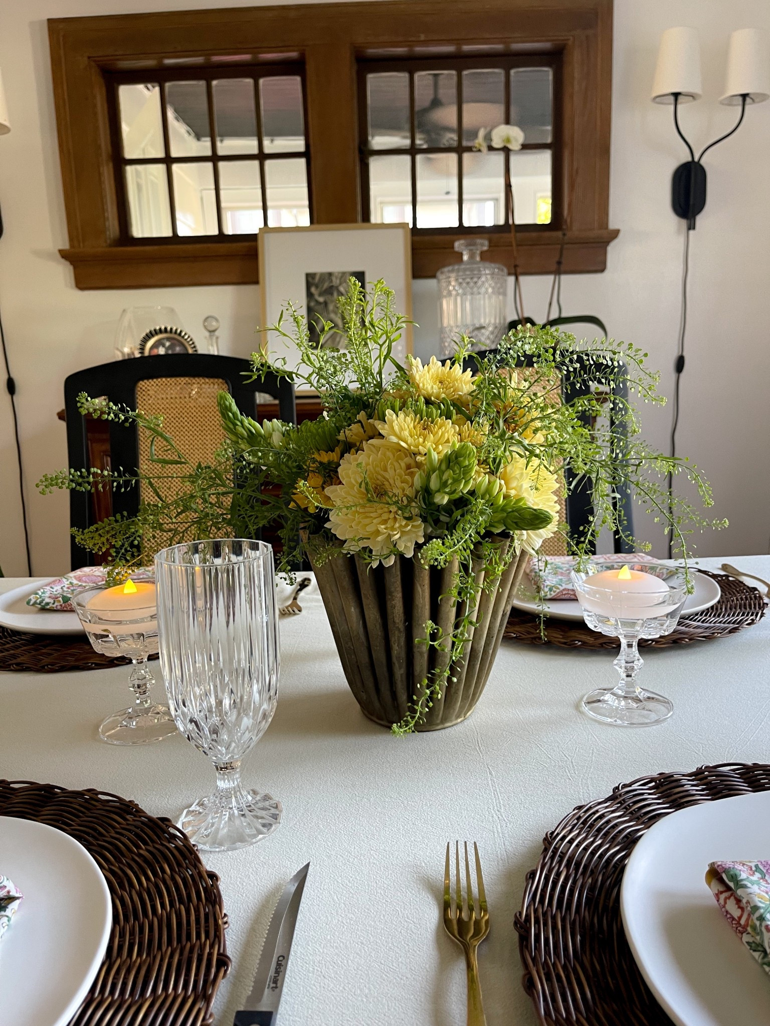 Table setting, table scape, table decor, Mother’s Day, floral arrangement, world market, Trader Joe’s flowers, rattan placemats, wipeable placemats, stamped napkins, ruffle tablecloth, crystal 