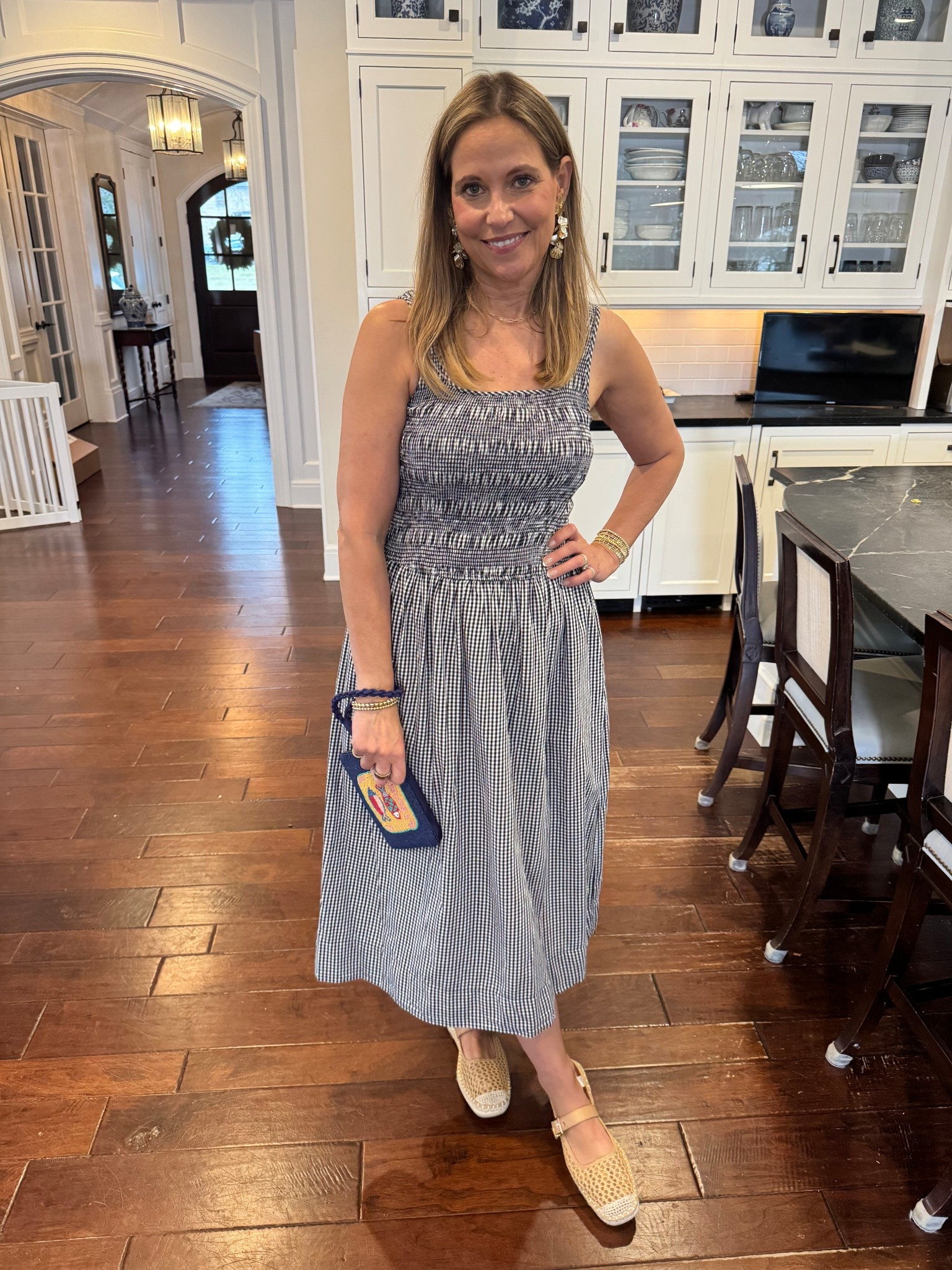 Instantly cute outfit alert! I’m absolutely loving this navy striped smocked dress, paired with bold statement earrings and a playful beaded wristlet. It’s a perfect ensemble for our upcoming vacation—effortlessly chic and ready for all the adventures ahead!

#LTKMidsize #LTKOver40