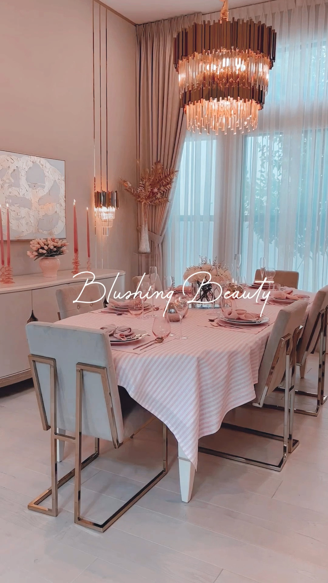 Get ready to be swept off your feet as I unveil a truly dreamy tablescape that's all about romance! Today, I've created a magical palette of pink and white, sprinkled with delightful gold accents. It's a combination that will make your heart skip a beat!
First things first, let's talk about the fabulous layers on the table. I started with a set composed by a delicate ceramic pink charger, topped it off with gorgeous plates featuring a gold rim. The result? Pure elegance! And to add a touch of glamour, I brought in rose gold cutlery—so chic!
Now, let's talk napkins. I've got a fantastic tutorial on how to fold them into adorable ribbon shapes (check out my previous videos!). Trust me, it's a simple yet charming detail that'll leave your guests in awe.
But wait, there's more! I turned the champagne glasses into seating cards! How, you ask? I simply placed these cute acrylic name tags on top, creating an oh-so-elegant way to show your guests where they belong. It's a little twist that adds a dash of excitement to your party! 
For the centerpiece, I wanted something timeless and enchanting. So, I kept it simple with beautiful white roses and delicate baby's breath. But to make it even more fabulous, I threw in a couple of golden picks. They add a touch of whimsy and elegance that'll make your guests swoon!
And let's not forget the sparkling glow that sets the mood just right. Those round gold mirrored candles from Balsam Hill? They're the ultimate secret to creating a captivating ambiance. Light them up, and watch as the room comes alive with a warm, flickering glow.
So, join me on this whimsical adventure as we dive into a world of pink, white, and gold. Let's create memories that will last a lifetime in this utterly romantic tablescape! I linked everything on my LTK page. 


#LTKhome