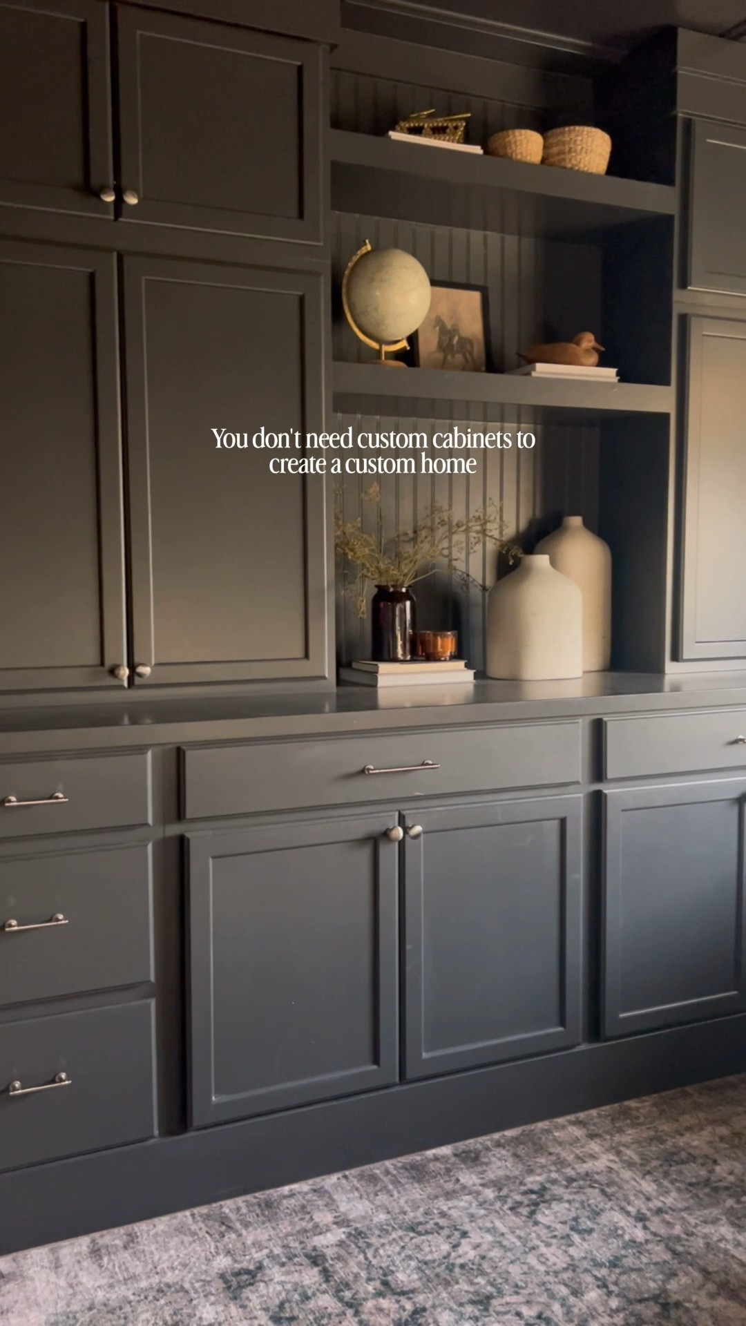 Create your own built ins with these unfinished cabinets! I stacked two 30” base cabinets in the middle, two 30” x 30” on the top, then used two 18” drawer cabinets on the ends and two 30” wall bridge cabinets for the top. Then I used 3/4” plywood and a 1 x 3 select pine to create my floating shelves in between! Then I used mdf trim to make a modern crown that reached the ceiling. My husband loves these!

#LTKHome