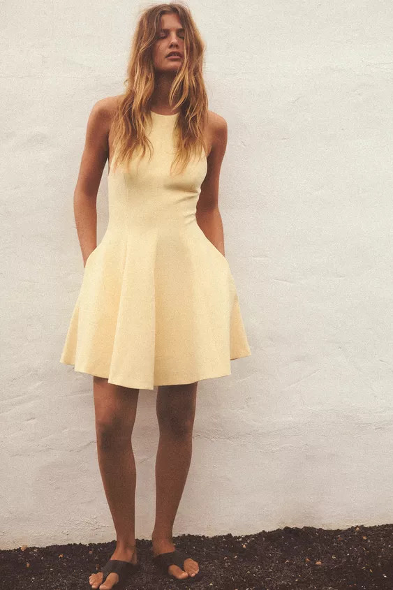 Short halter neck dress. Open back. Hidden in-seam side pockets. Matching inner lining. Back clos... | Zara Canada