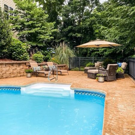 Create a beautiful outdoor pool and patio entertainment space with natural wicker furniture and summer decor accents including bright pillows, plants, lanterns, and a galvanized metal serving tray. 

#LTKHome #LTKSeasonal #LTKStyleTip