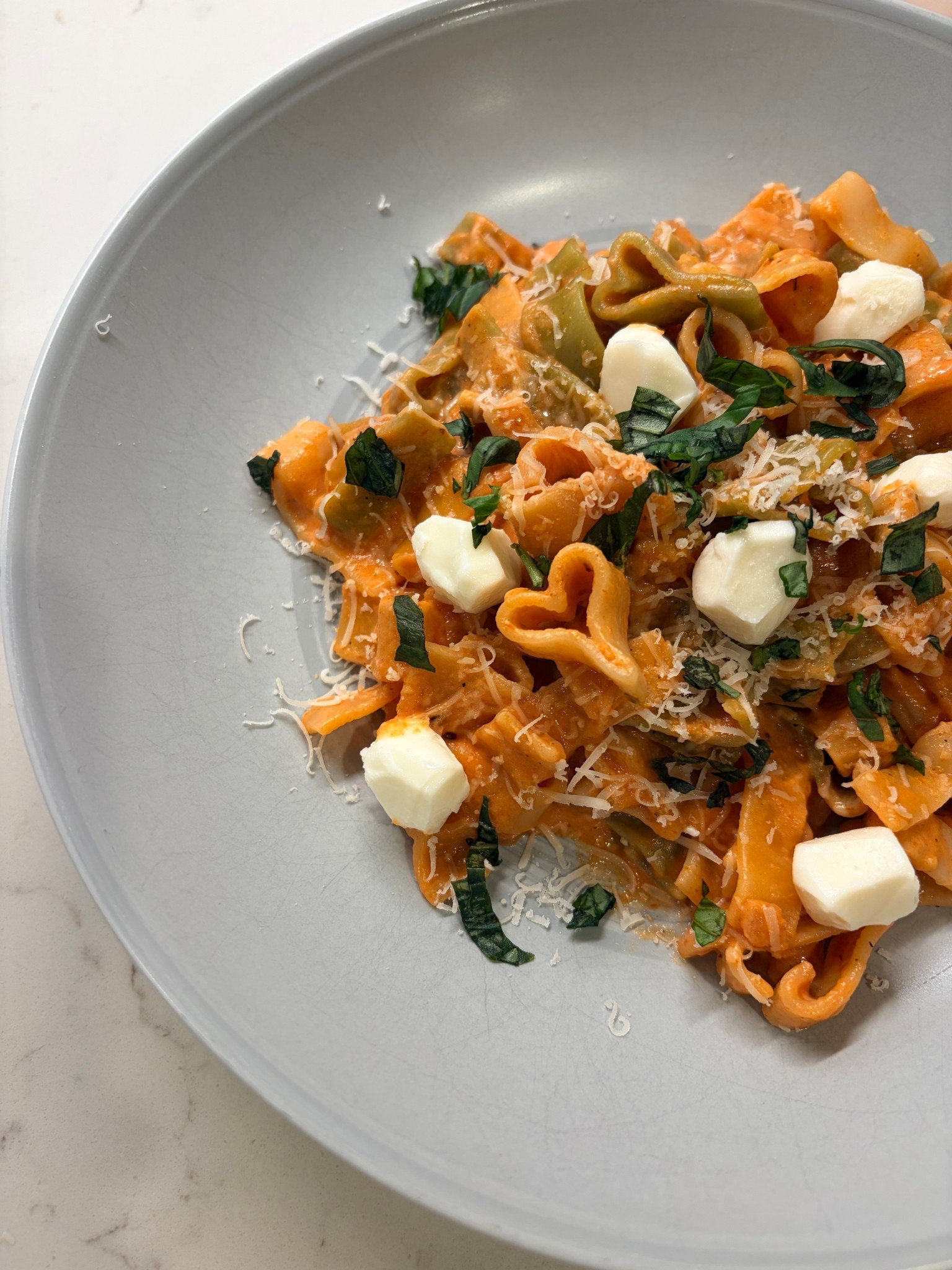 This heart pasta with blush sauce is not only cute but delicious! My whole family loved it. Perfect for Valentine’s Day!💕. Recipe Below👇🏻

I’ve linked everything I used, including the heart shaped pasta and heart spoon! Got all of my groceries @Target  

Heart Pasta with Blush Sauce

Ingredients
2 Tbsp butter
1 shallot, diced (or 1/2 yellow onion)
3 garlic cloves, minced
28oz can of tomato sauce
1 Tbsp tomato paste
1 tsp salt
1/4 tsp pepper
1 1/2 tsp oregano
Sprinkle of sugar
1/3 cup white wine
3/4 cup heavy whipping cream
Heart shaped pasta (or any pasta of your choice)
3/4 cup freshly grated Parmesan + more for serving (shredded Parmesan works well too)
Mozzarella pearls
Fresh basil 

Directions
1.Melt butter in sauté pan or large skillet on medium heat
2.When the butter is melted, add shallot and garlic. Let cook 1-2 min. then pour in tomato sauce and white wine. Cook uncovered about 7 minutes, stirring occasionally 
3.Add in tomato paste and spices. Stir to mix well. Place lid on pan, leaving a little space open. Turn to low and cook about 20 min.
4.While sauce cooks, cook pasta to package instructions.
5.remove lid and stir in heavy cream and Parmesan cheese. Stir to combine. Taste and add salt and pepper if you wish.
6.Plate pasta and top with mozzarella pearls, freshly grated Parmesan cheese, and fresh basil.

Serve.


#LTKfoodie #LTKValentine #LTKHome