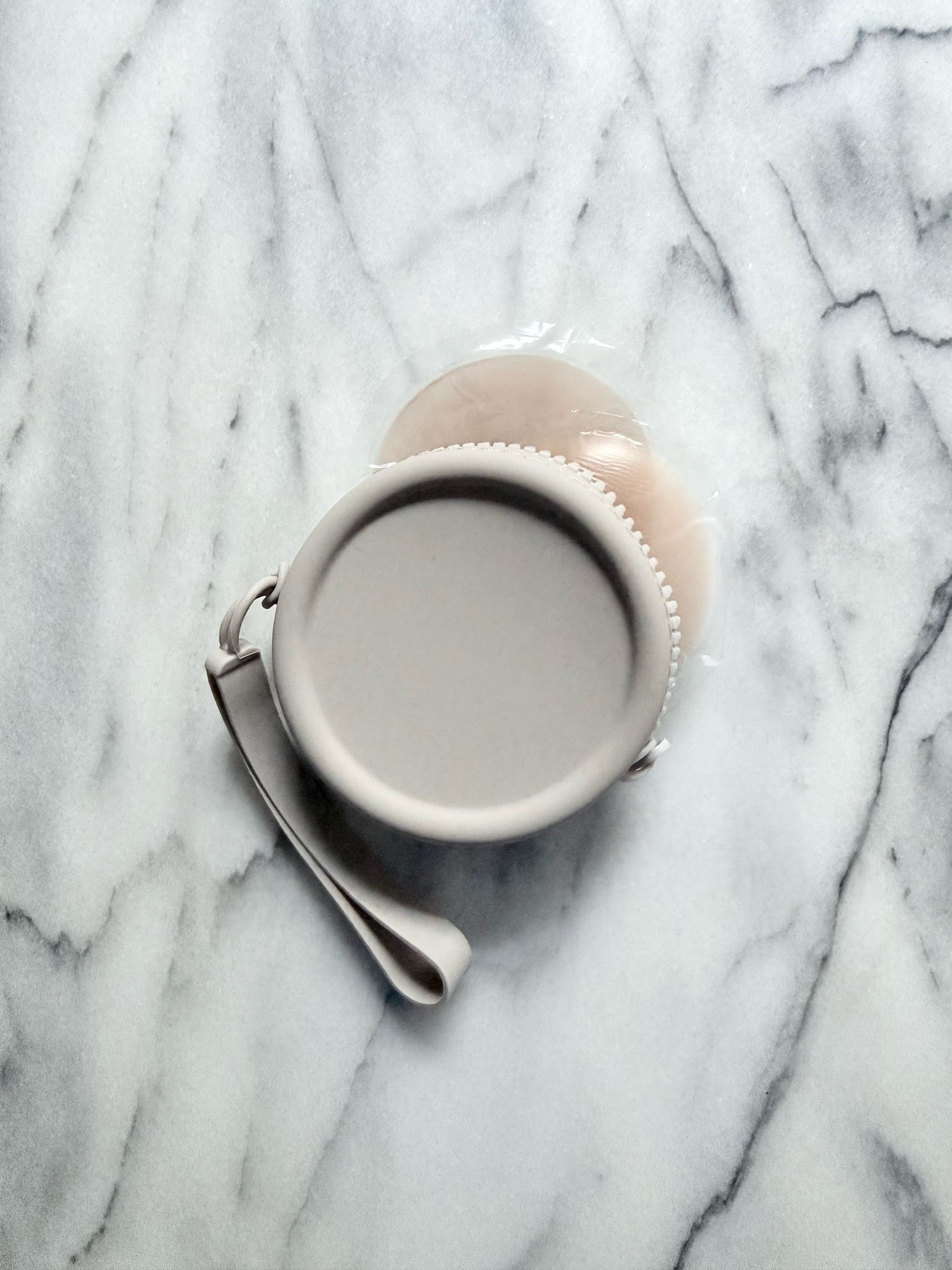 This round silicone pouch is great for storing makeup minis, your wired headphones, hair ties, change, and in my case, nipple covers!

#LTKgrwm #LTKSaleAlert #LTKTravel