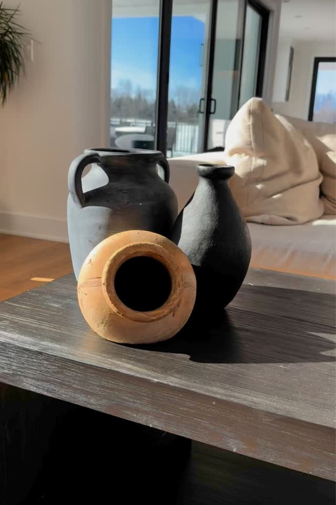 One week and I’ve already changed my mind! I thought the white was a little too much for our decor on the living room table so I traded it out with a black one and love it so much more! 😍 Sometimes it’s just a trial and error 🤷🏻‍♀️. For those of you that saw my previous reel, do you like the white or black better? Let me know below! ⬇️ 

#modernranchhome #modernwesternhome #westernhomedecor #myhomedesign #myhomefinds 

#LTKHome #LTKStyleTip