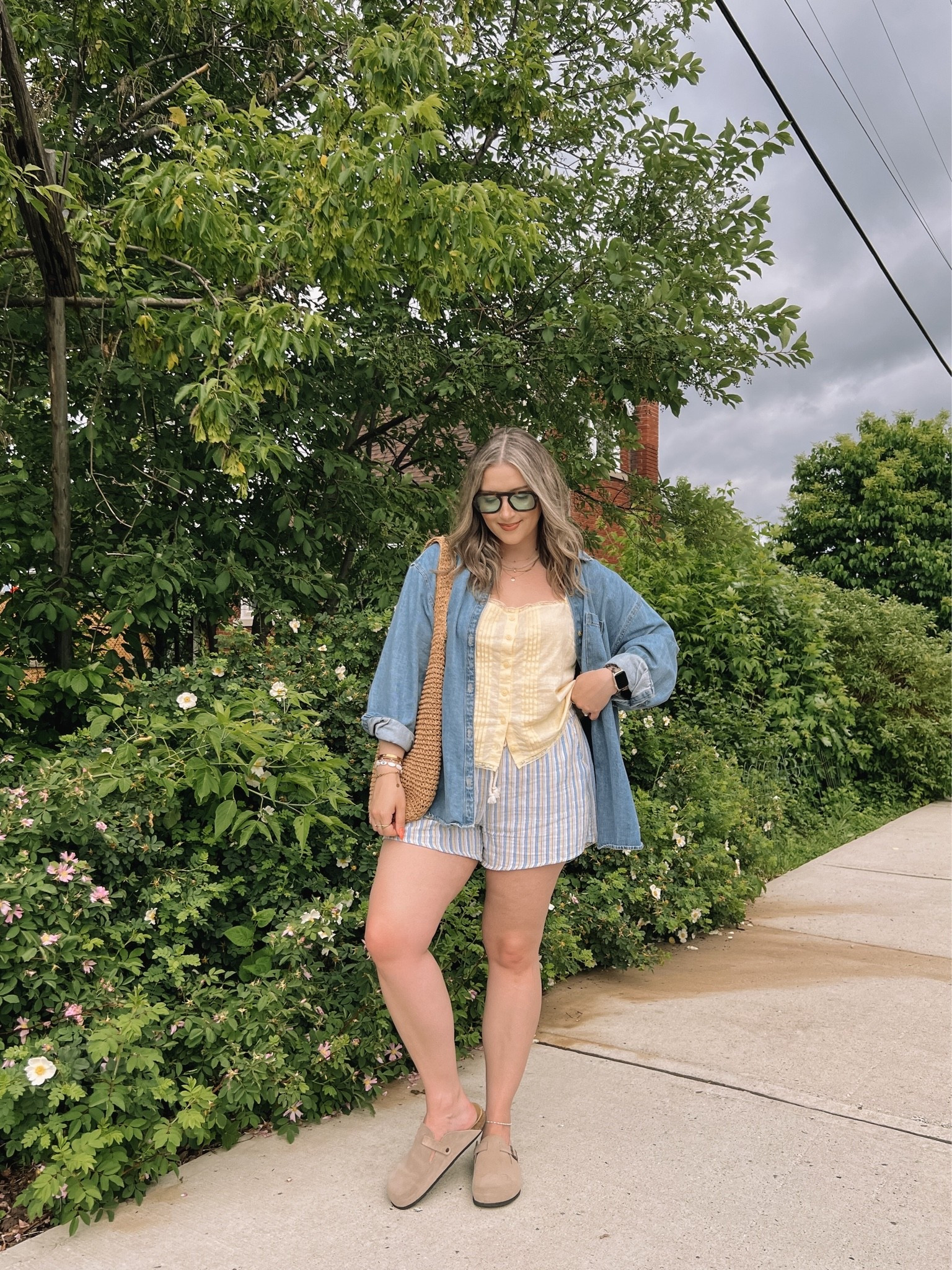 Easy summer outfit! Canadian links are under “similar products”. Wearing my usual size L in the striped shorts, butter yellow tank top, and oversized denim shirt. Straw tote bag is one of my fave Amazon finds! Linked similar clogs

#LTKsummer #LTKmidsize #LTKstyletip