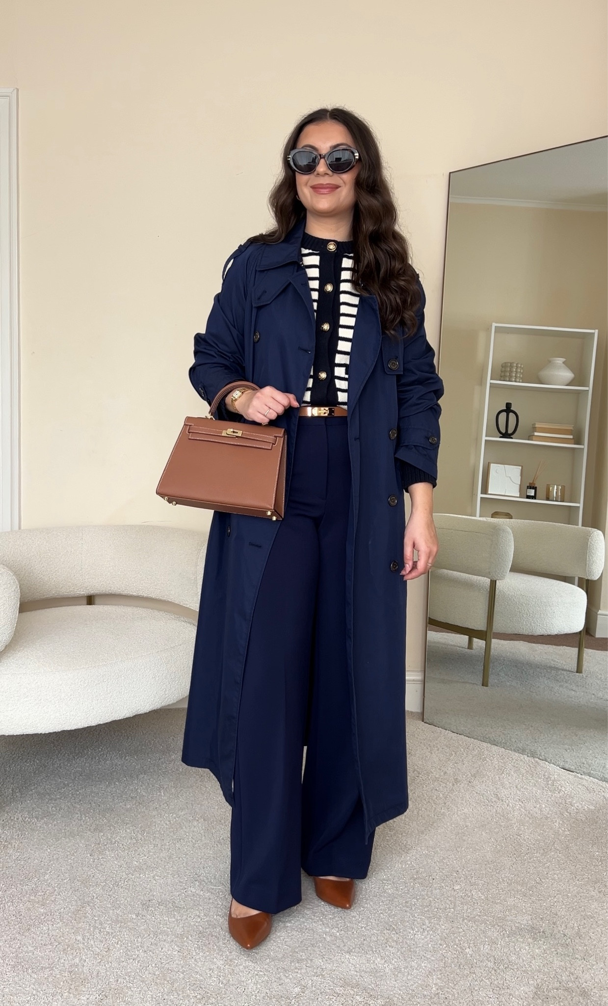 One of my all time favourite colour combinations: navy and tan. Smart & chic Winter to Spring transitional outfit.
Cardigan is from Karen Millan, wearing size S. Trousers are from &otherstories, wearing size UK10. Trench coat is from Ralph Lauren, wearing size S. Flats are from Ralph Lauren. Handbag is from Totes Luxe Uk.

#LTKstyletip #LTKeurope #LTKfindsunder100
