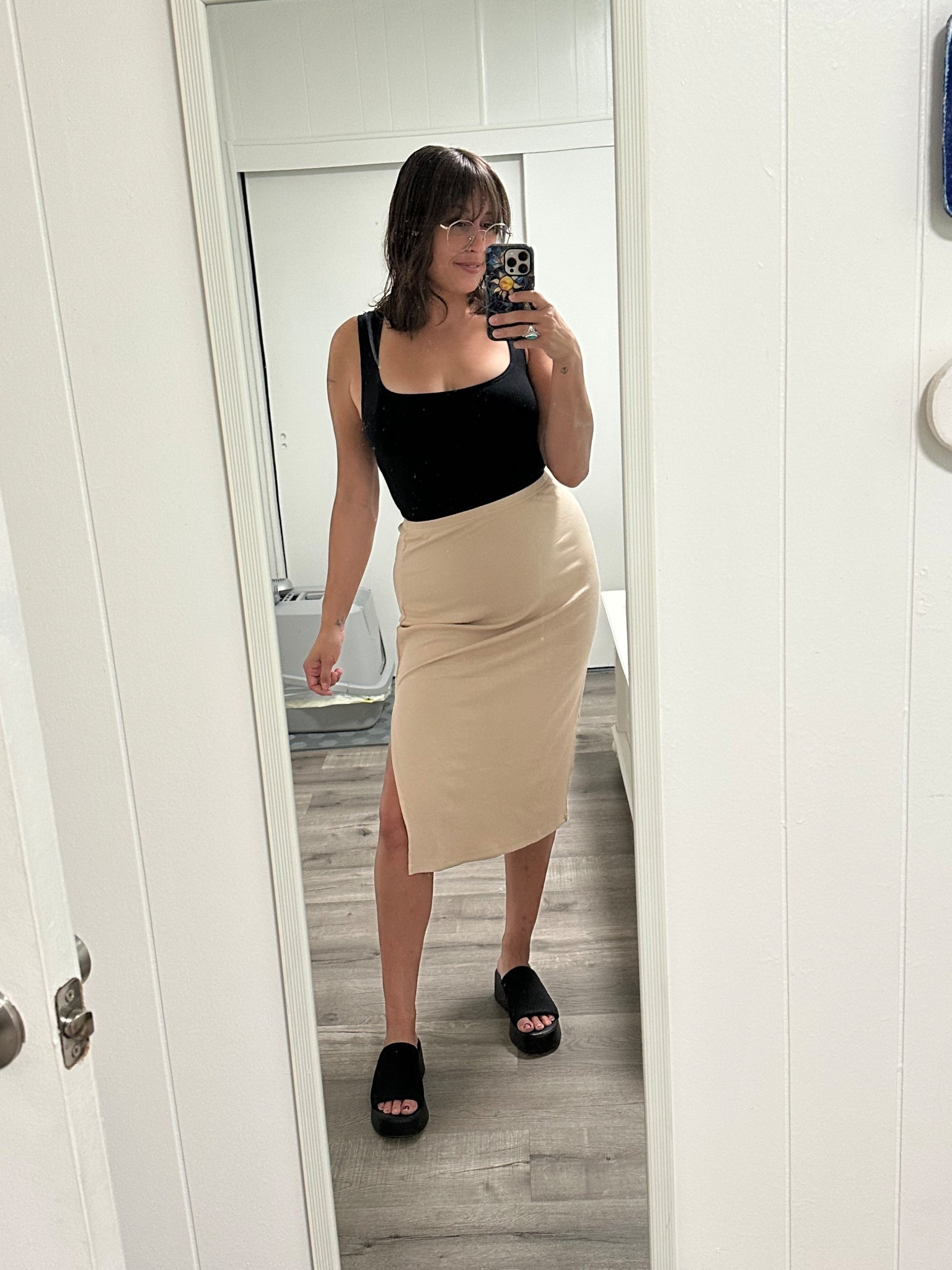 Work? School? Shopping? Date night?  Yes yes yes. This look is so doable for any occasion. A tan pencil high waisted skirt with a slit and a black ruffled tank. Classy and classic

#LTKWorkwear #LTKSeasonal #LTKStyleTip