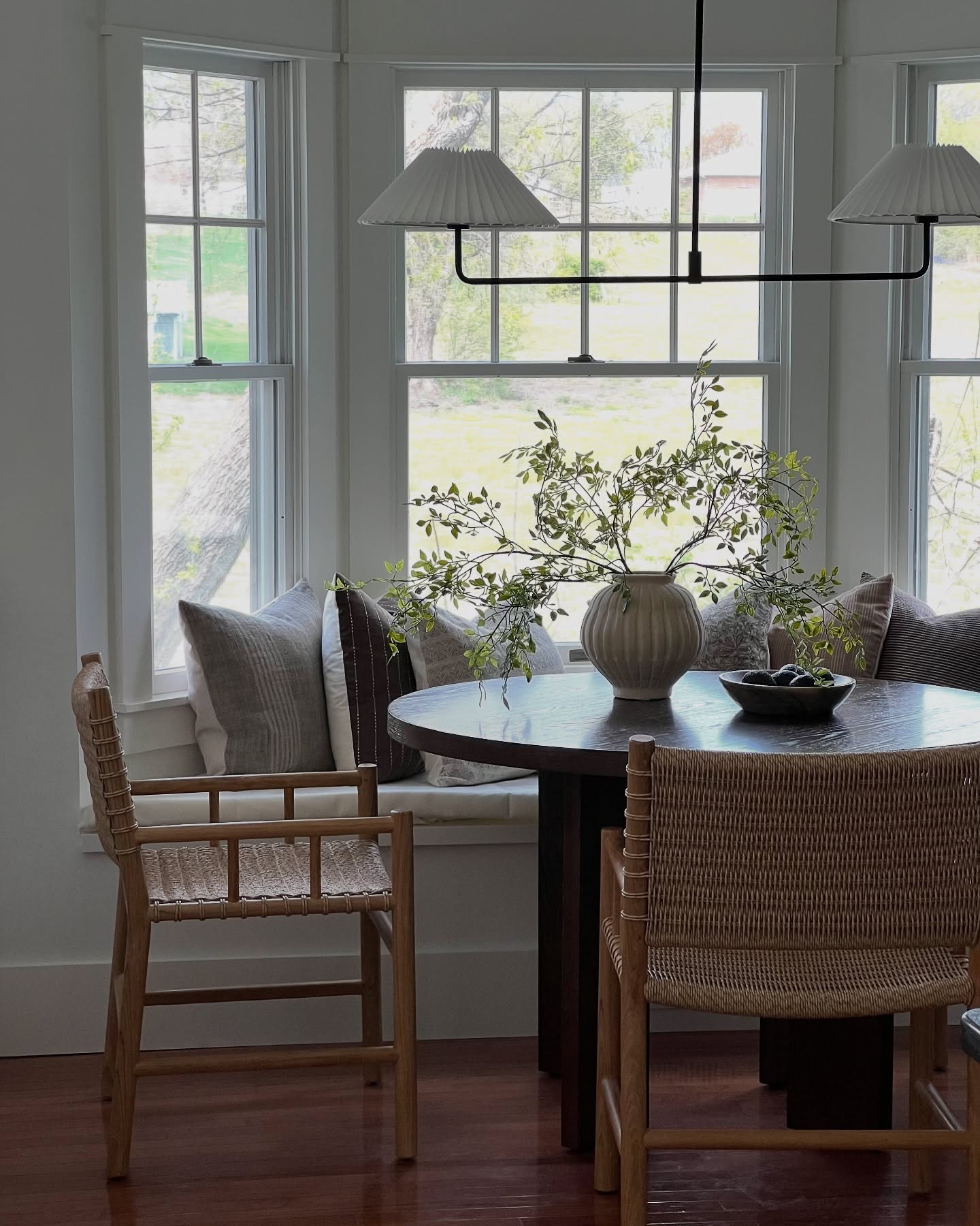 Sharing a view I haven’t shown in a while! Still can’t believe how this little nook transformed 😍 (Swipe for the before). 

From day one, we envisioned this little corner with a cozy window seat and a quaint round table—somewhere to sip coffee, share slow mornings, and soak in the sunshine. ☀️ 

Now, it is just that - and we couldn’t love it more!🥰

Are you more of a slow morning kind of person or do you hit the ground running?🏃 

🔗Comment SHOP for links! 

✨Follow @jennachristianblog for more home inspo, affordable finds, and design tips! 

#breakfastnook #diningnook #windowseat #kitchennook #kitchendesign #kitchendecor #roundtable #neutralhome #vintagemodern