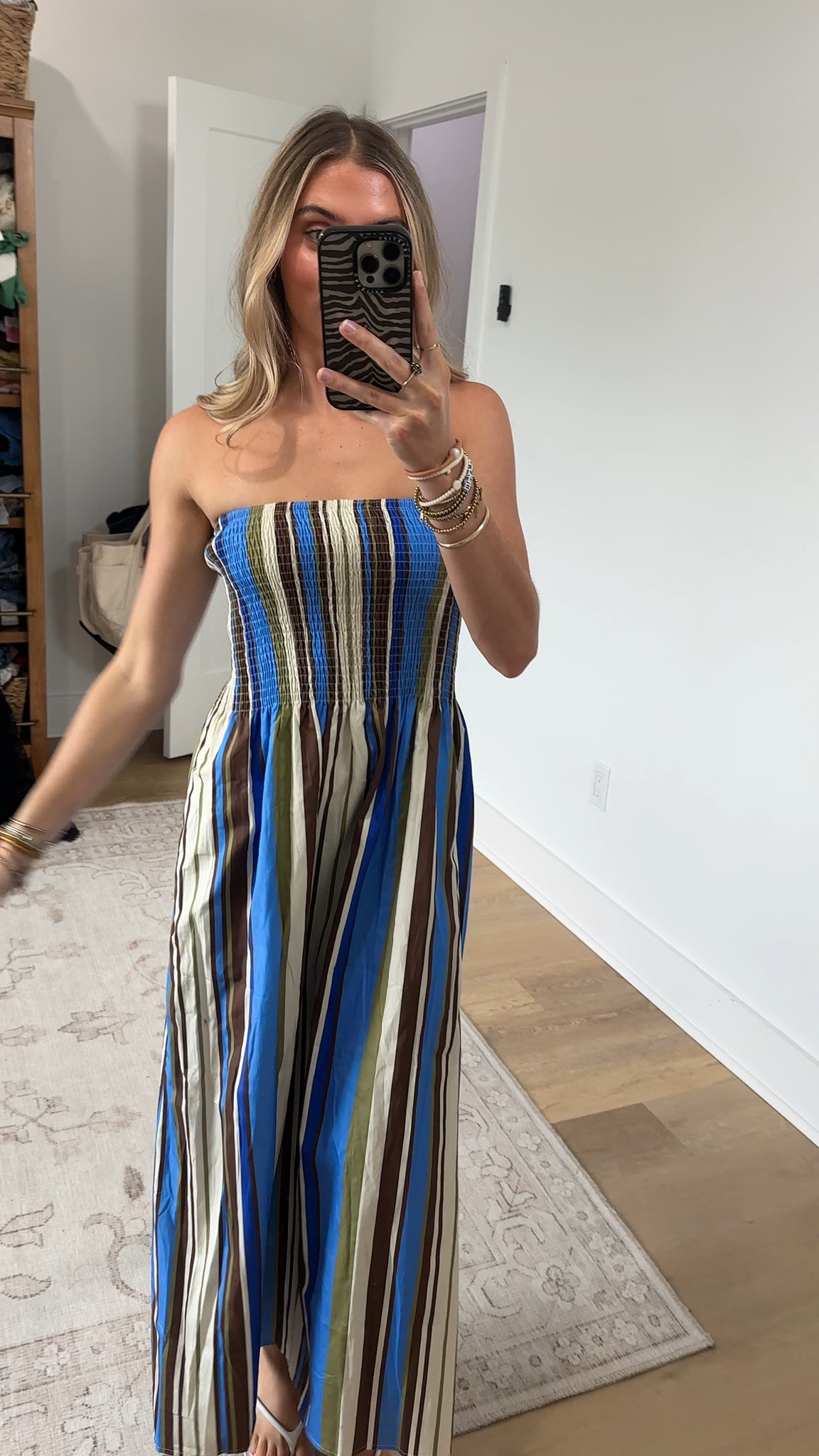 @Petal & Pup size xs The Nella Strapless Maxi Dress in Blue/Khaki Stripe is your new warm-weather wardrobe hero. Its strapless design and clean straight neckline give you that effortlessly chic look, while the elasticised shirred bodice hugs your curves and moves with you all day long—no constant adjusting required.

#LTKootd #LTKWedding #LTKSeasonal