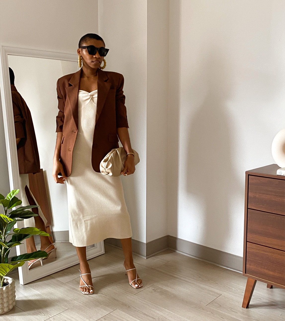 Neutral outfit with a tube dress in beige layered with a brown oversized blazer, strappy heels and beige purse.

#summervacation #amazonfinds #tubedress #bandeaudress 

#LTKunder50 #LTKtravel #LTKstyletip