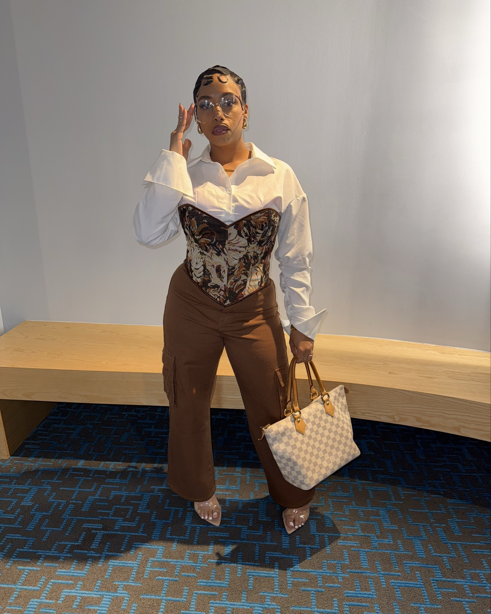 Effortless luxe but make it versatile 
Layered a crisp white shirt under a tapestry corset for that chic-meets-edgy vibe, paired with cargo-style trousers for balance. Finished it off with clear heels + my go-to designer tote.

This look is giving:
🤎 Elevated neutrals
🤎 Structured but feminine
🤎 Day-to-night ready

Shop the exact inspo


#LTKStyleTip #LTKFallSale #LTKOver40