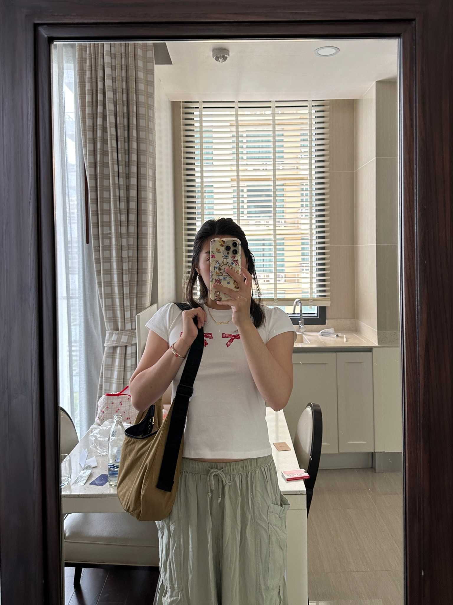 what i wore in Thailand: white bow tee and free people flowy pant and baggu crescent bag

#LTKstyletip #LTKtravel #LTKAsia