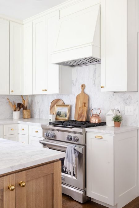 White and wood kitchen with wood cutting board, Cooper kettle, brass hardware 

#LTKFind #LTKhome #LTKSeasonal
