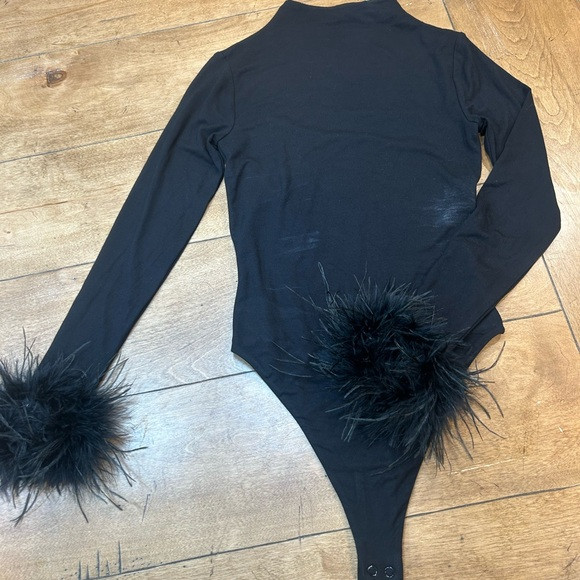 Naked Wardrobe Black Long Sleeve Bodysuit with Feather Cuffs | Poshmark