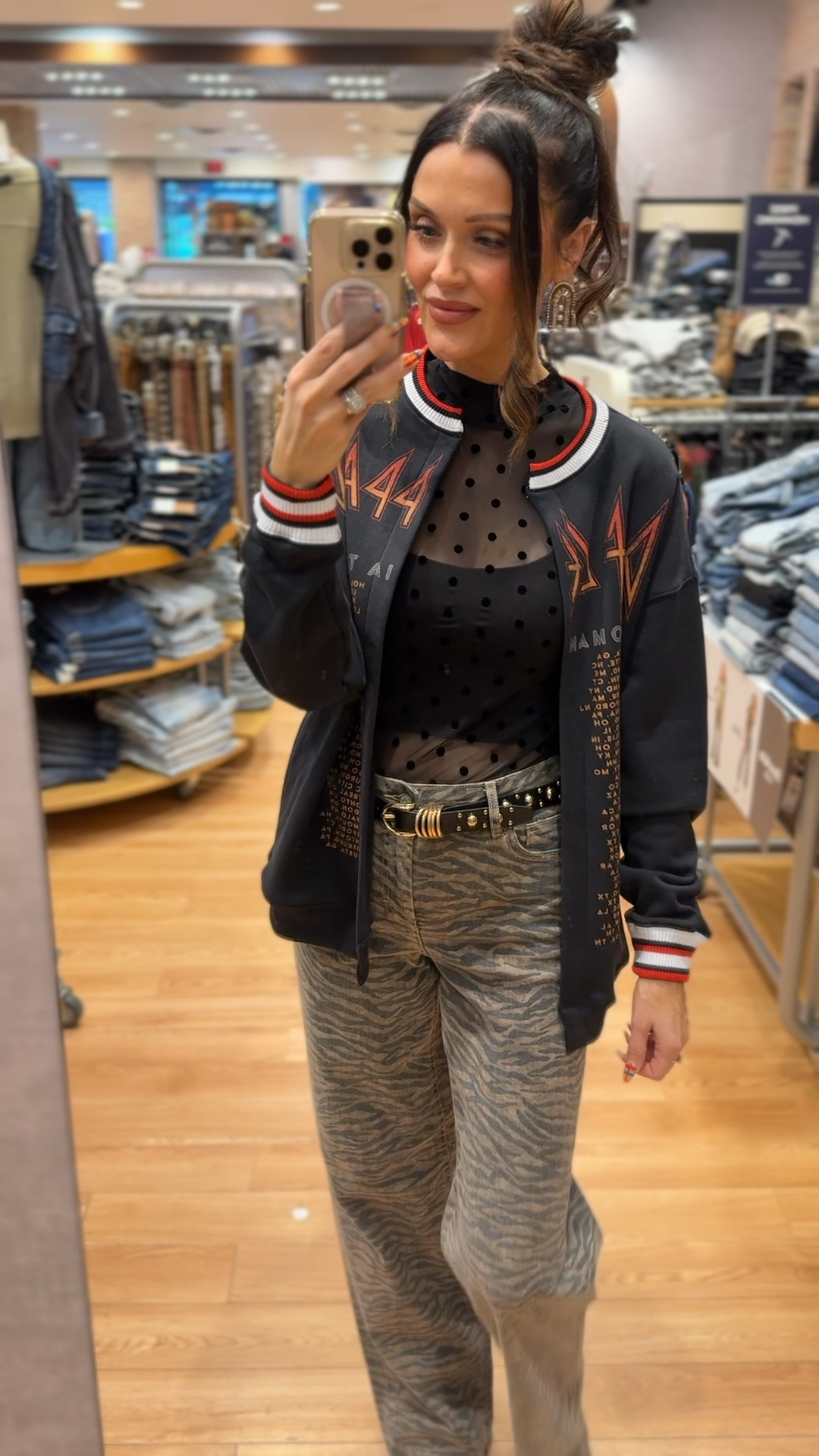 Def Leppard oversized cardigan
Black sheer polkadot top 
Black tank top bra 
Tiger print jeans 
Black gold studded belt 
Sand colored booties 
All pieces are from the buckle 

#LTKFindsUnder100 #LTKootd #LTKGiftGuide