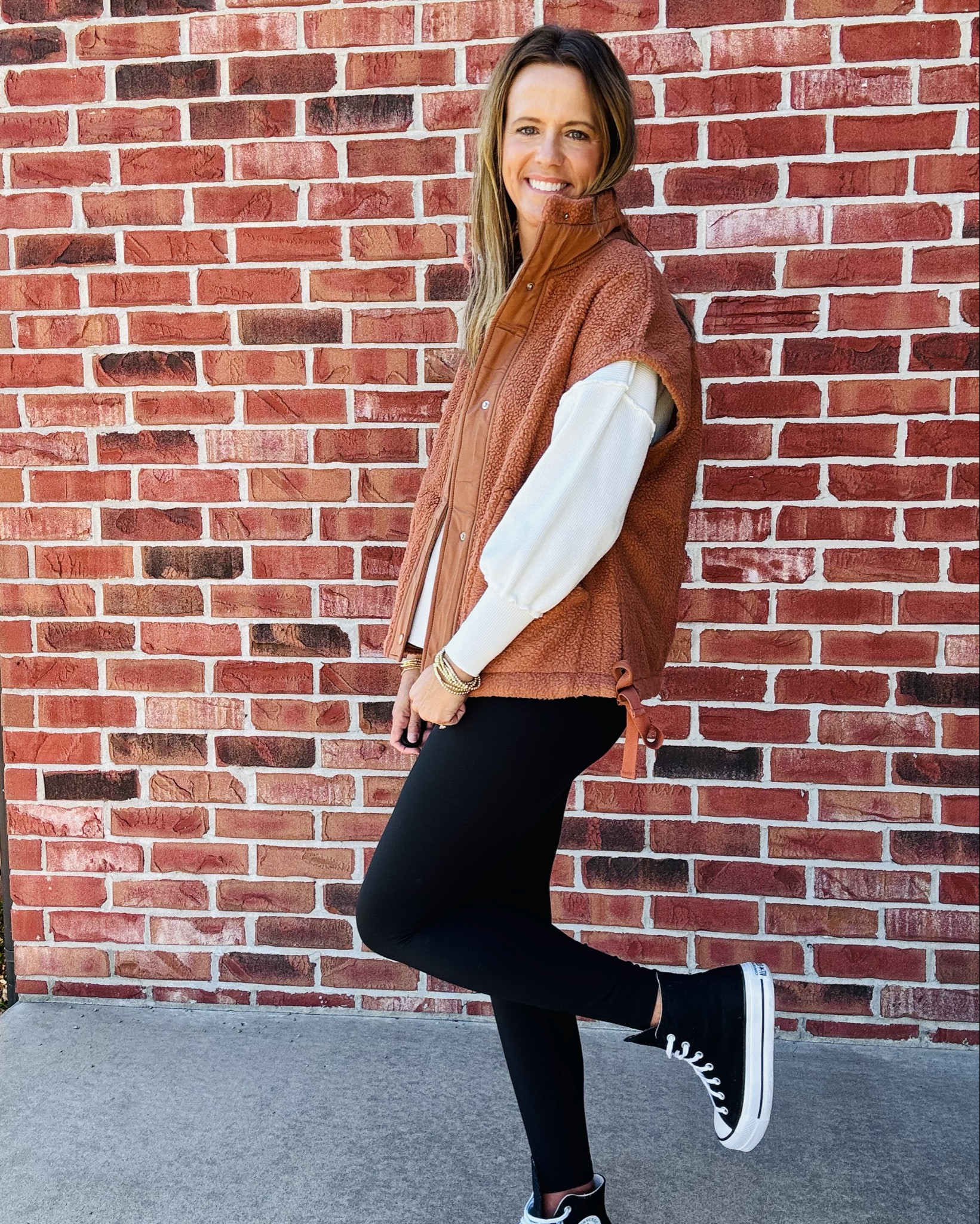 Fall layers done right 🍂 This oversized sherpa vest is the coziest piece for cooler days — perfect for tossing over a basic top and heading out the door. Paired with my favorite CRZ YOGA pants (so soft and flattering!) and classic Converse high tops for that casual-chic vibe.

#FallFashion #LTKFallStyle #CRZYOGA #SherpaVest #CasualStyle #OOTD #ShopLTK #ConverseStyle #FallOutfitIdeas #MidwestMamaStyle

#LTKActive #LTKOver40 #LTKShoeCrush
