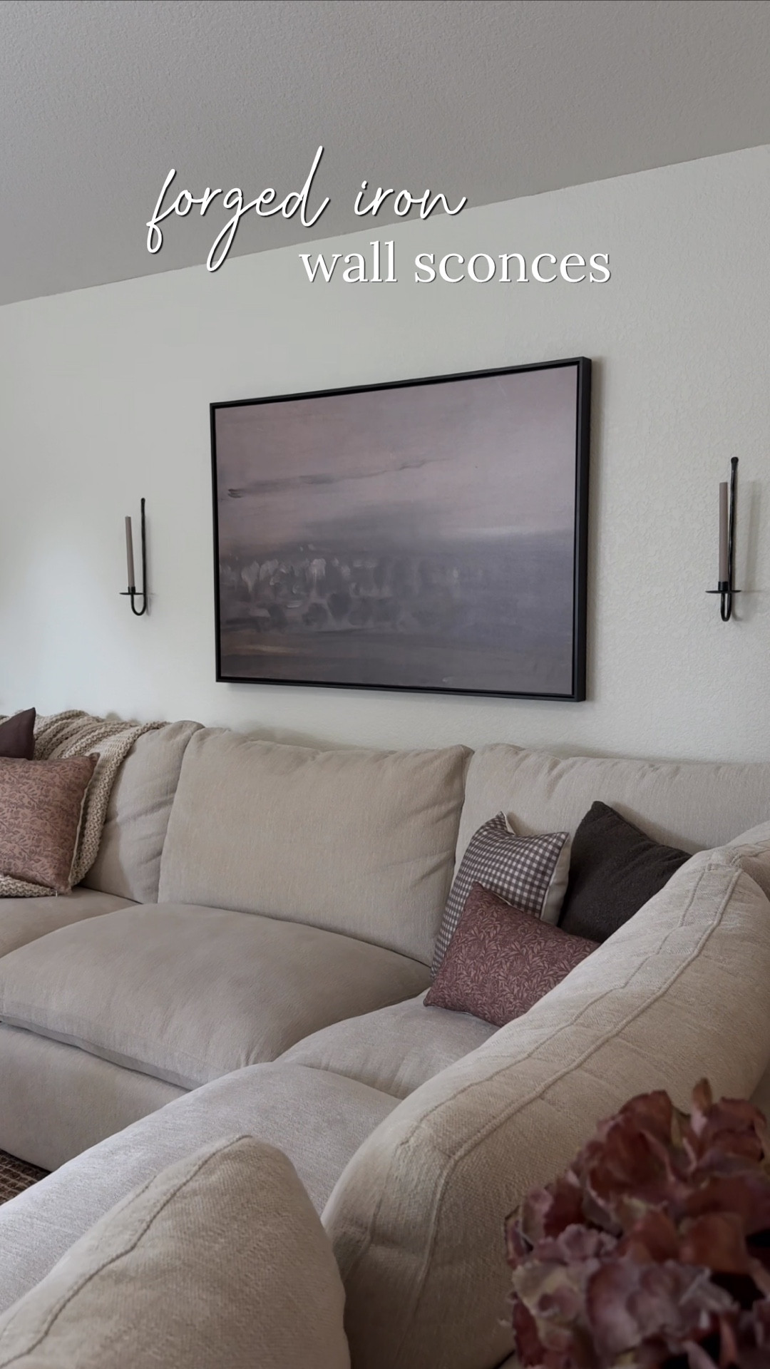 These forged iron candle sconces completely elevated this look. I love sconces on either side of a large piece of art. 
They come with interchangeable bases for pillar or taper candles. 
•
•
Canvas wall art, neutral art, abstract art, sconces, candle sconces, taper candle sconces

#LTKHome