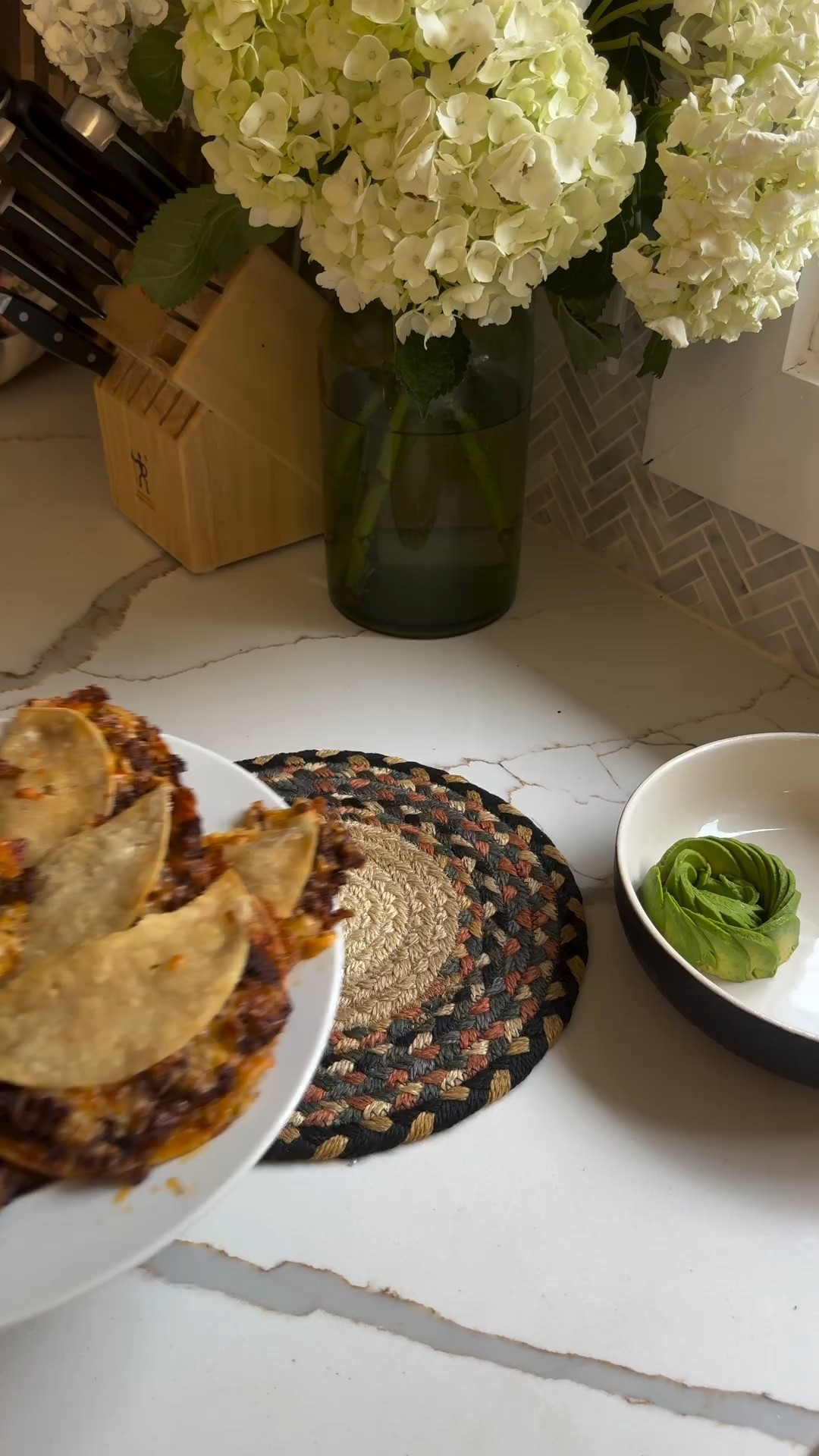 Crispy tacos is a new favorite around here and I love that you can customize it so easily depending on what you have at home! For these I used ground beef but you could easily swap the beef for turkey or chicken! 

Olive oil spray 
1 lb ground beef
1 package taco seasoning 🌮 @sietefoods 
8 small corn tortillas
3 tbsp cheddar cheese spread with hatch chile 🌶️ @traderjoes 
1 cup Mexican or cheddar cheese
For serving: avocado, pico de gallo salsa 

1. Cook beef in a pan in olive oil over medium heat, add taco seasoning and mix. Cook until cooked through. 

2. Add a wet paper towel to a large plate, add your tortillas and cover with another soaked paper towel. Microwave for 30-60 seconds until the tortillas are a bit softer.

3. Spray a sheet pan with olive oil and line up the tortillas. Spread cheddar cheese on each tortilla, as well as add ground beef and top with shredded cheese. Carefully fold up each tortilla and spray with olive oil. I placed a wire rack on top, you can also use another pan. Bake in the oven for about 10 minutes at 375F until crisp. Don’t worry if they break! They’re still gonna be delicious.